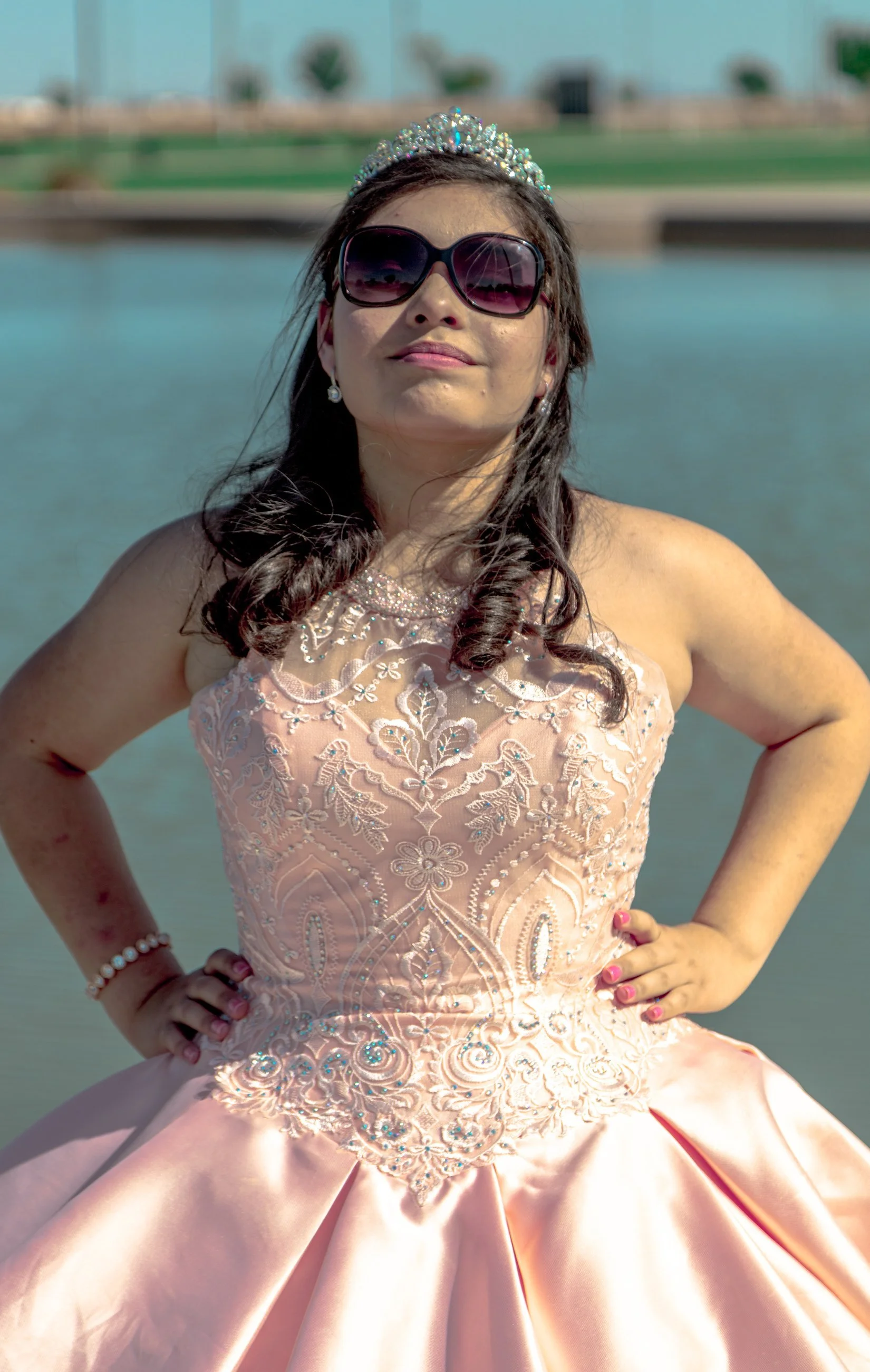 Portrait of a young woman twirling in a sparkling gown, celebration portrait photography by Everlux Photo Co.