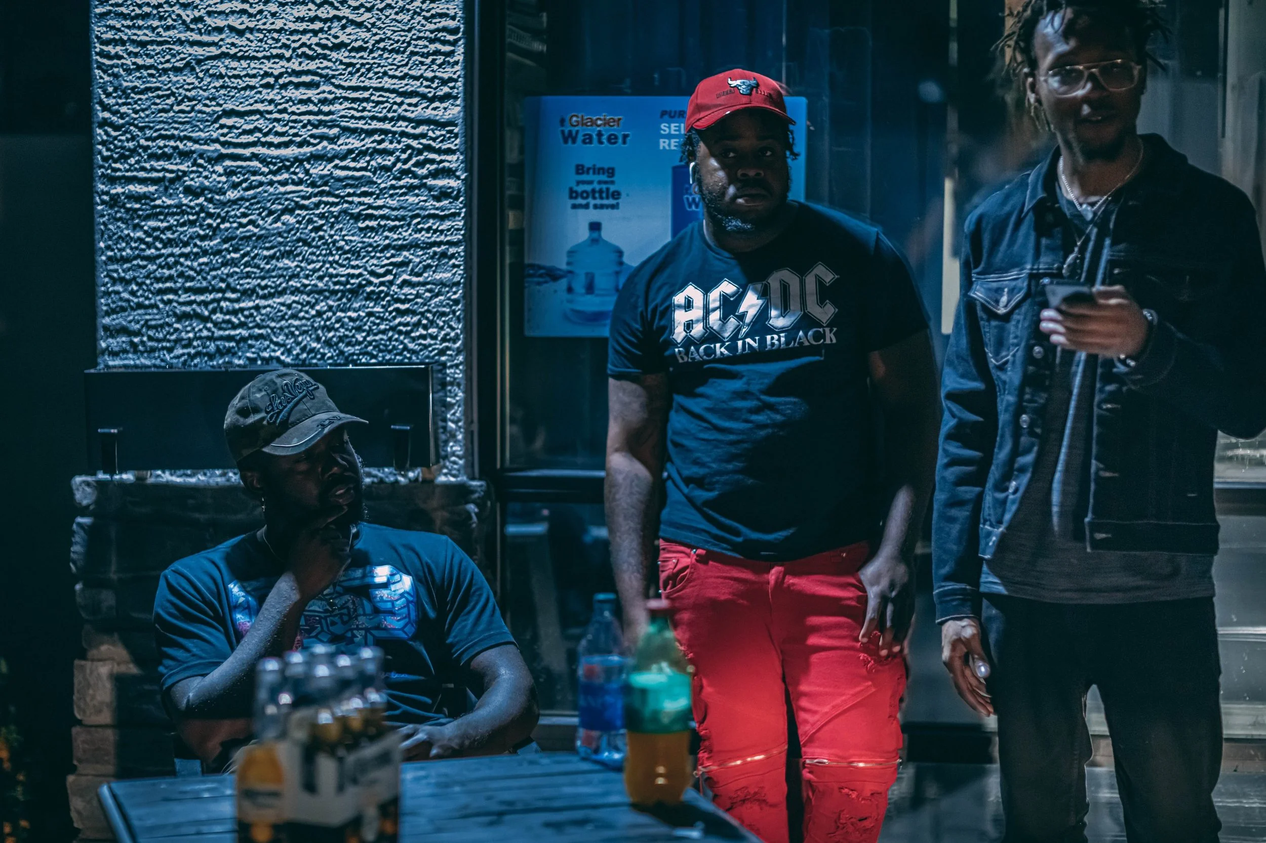 Street-style group portrait at night with musicians, urban nightlife photography by Everlux Photo Co.