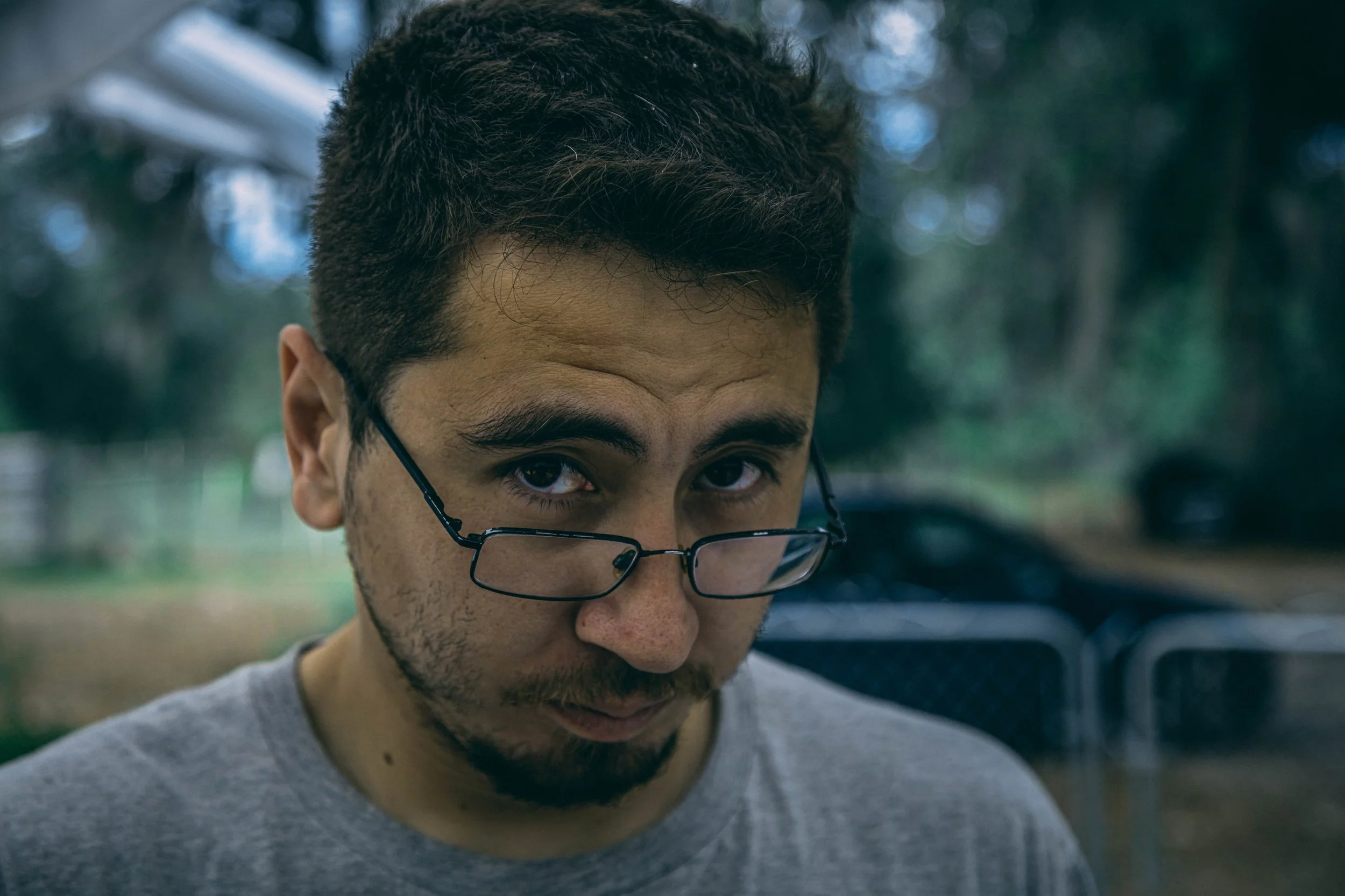 Outdoor portrait of a man with glasses in soft natural light, portrait photography by Everlux Photo Co.