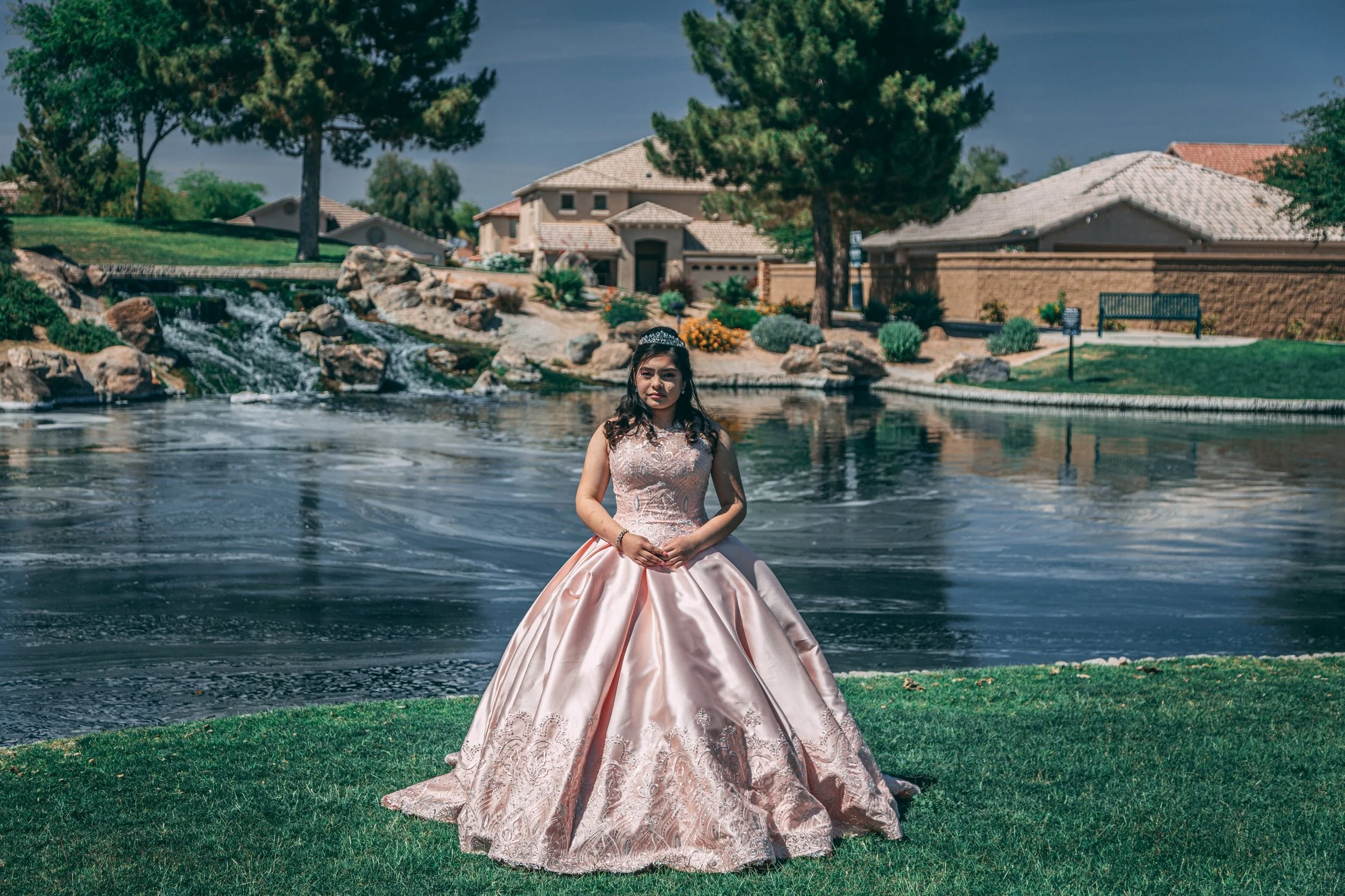 Outdoor portrait of a young woman in a pink quinceañera gown at golden hour, celebration portrait photography by Everlux Photo Co.