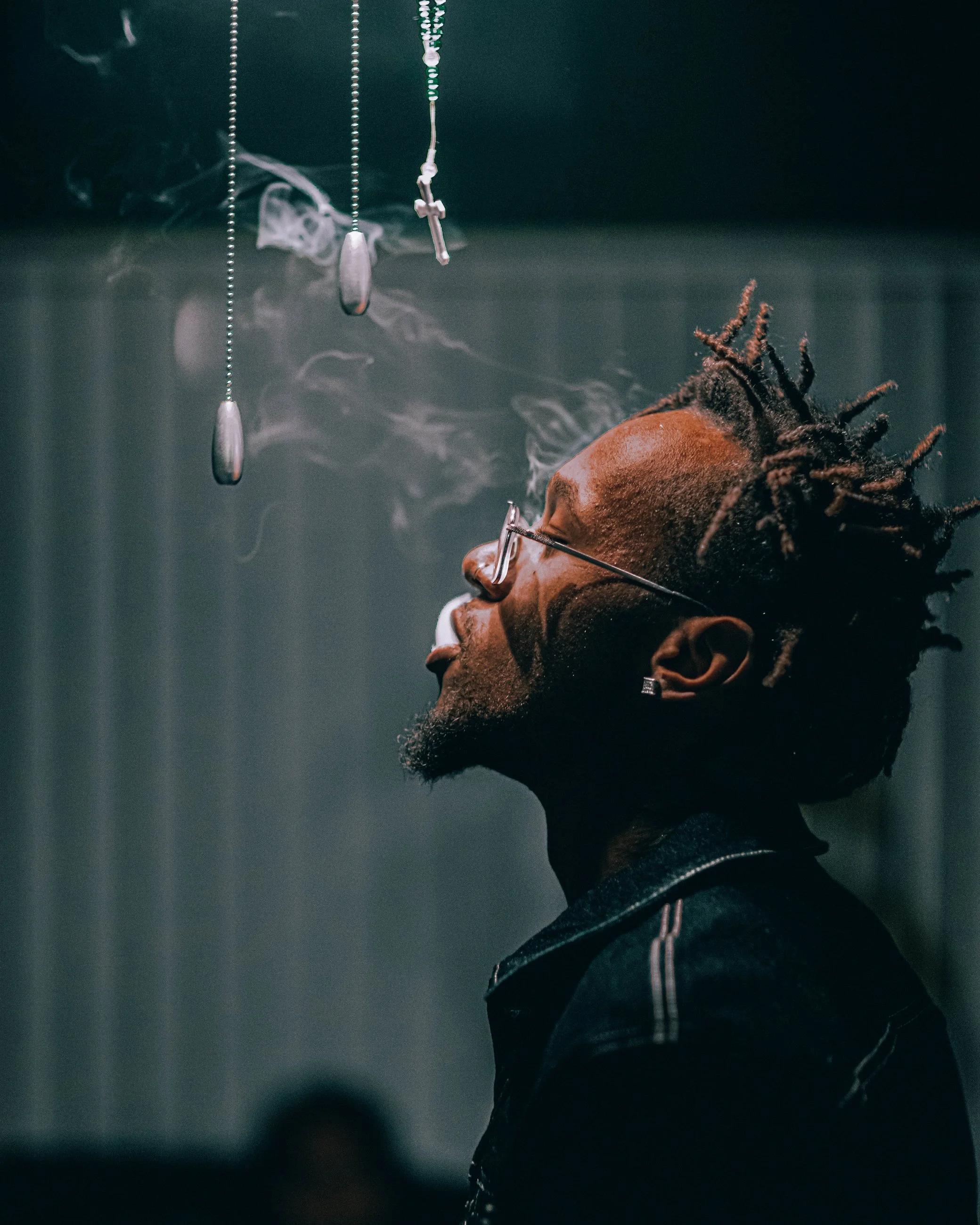 Dramatic portrait of a man with head tilted back, artistic nighttime photography by Everlux Photo Co.