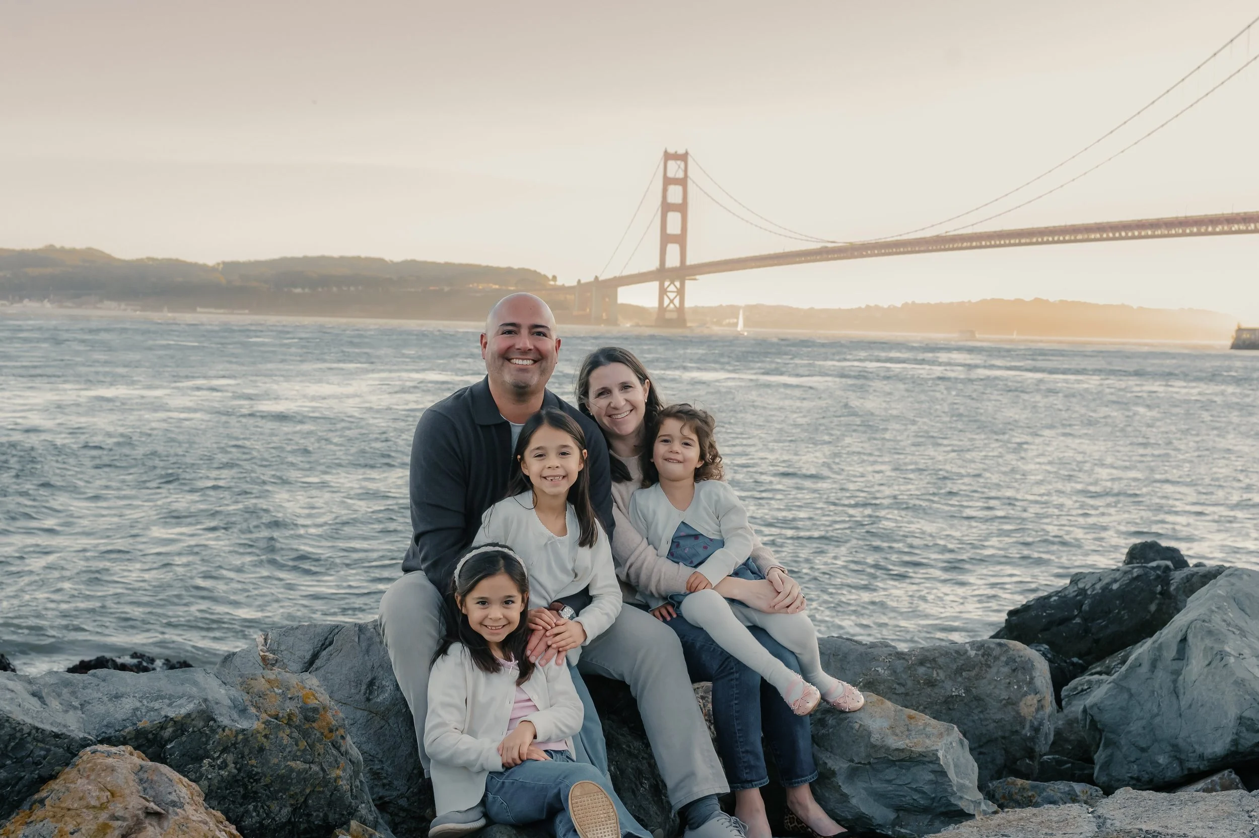 family-snuggling-golden-gate-bridge.jpg