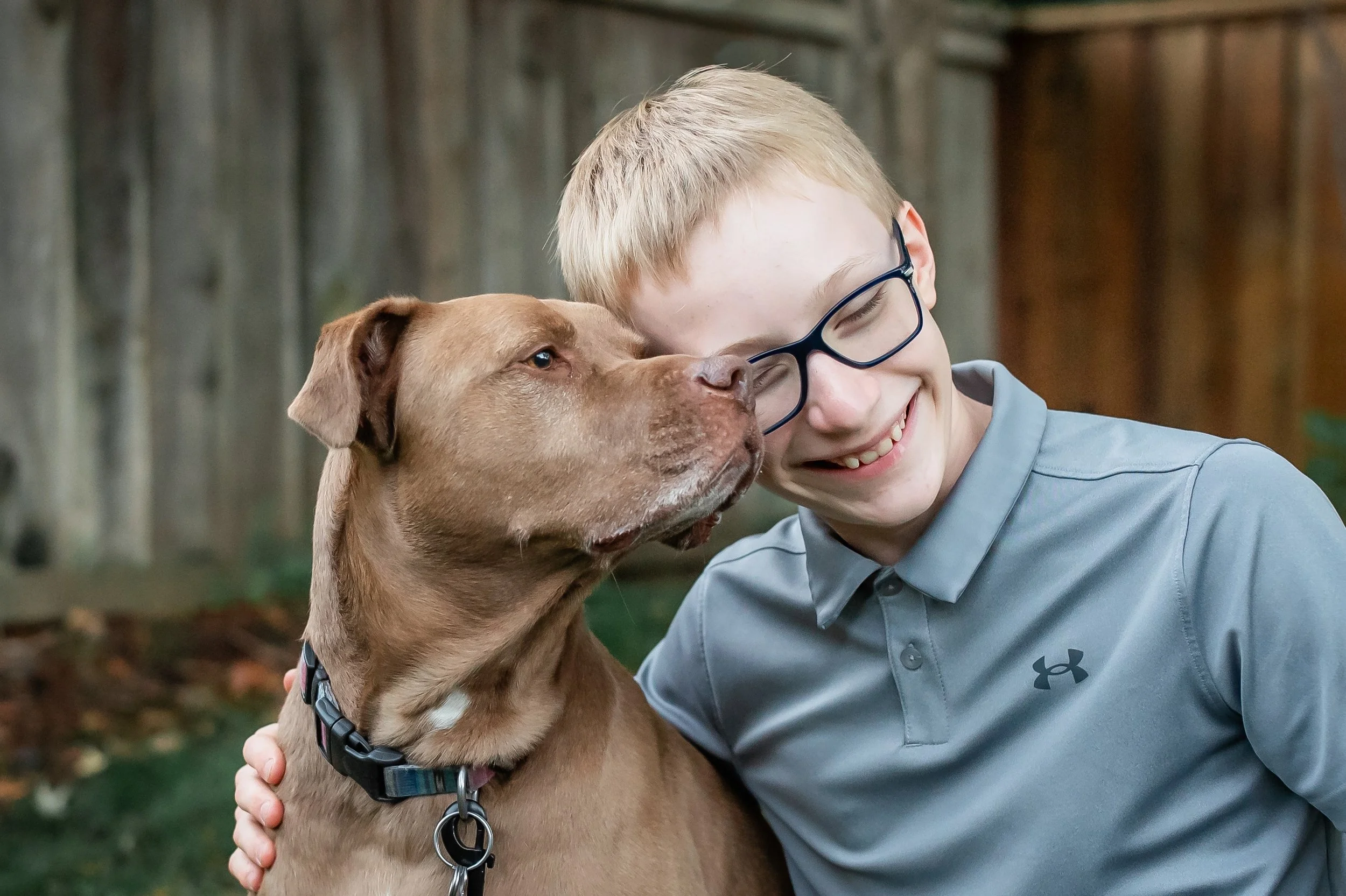 children-petting-family-dog-during-photo-session.jpg