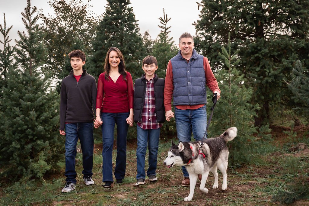 Family of four with their dog during an outdoor holiday family photography session in Sonoma County.