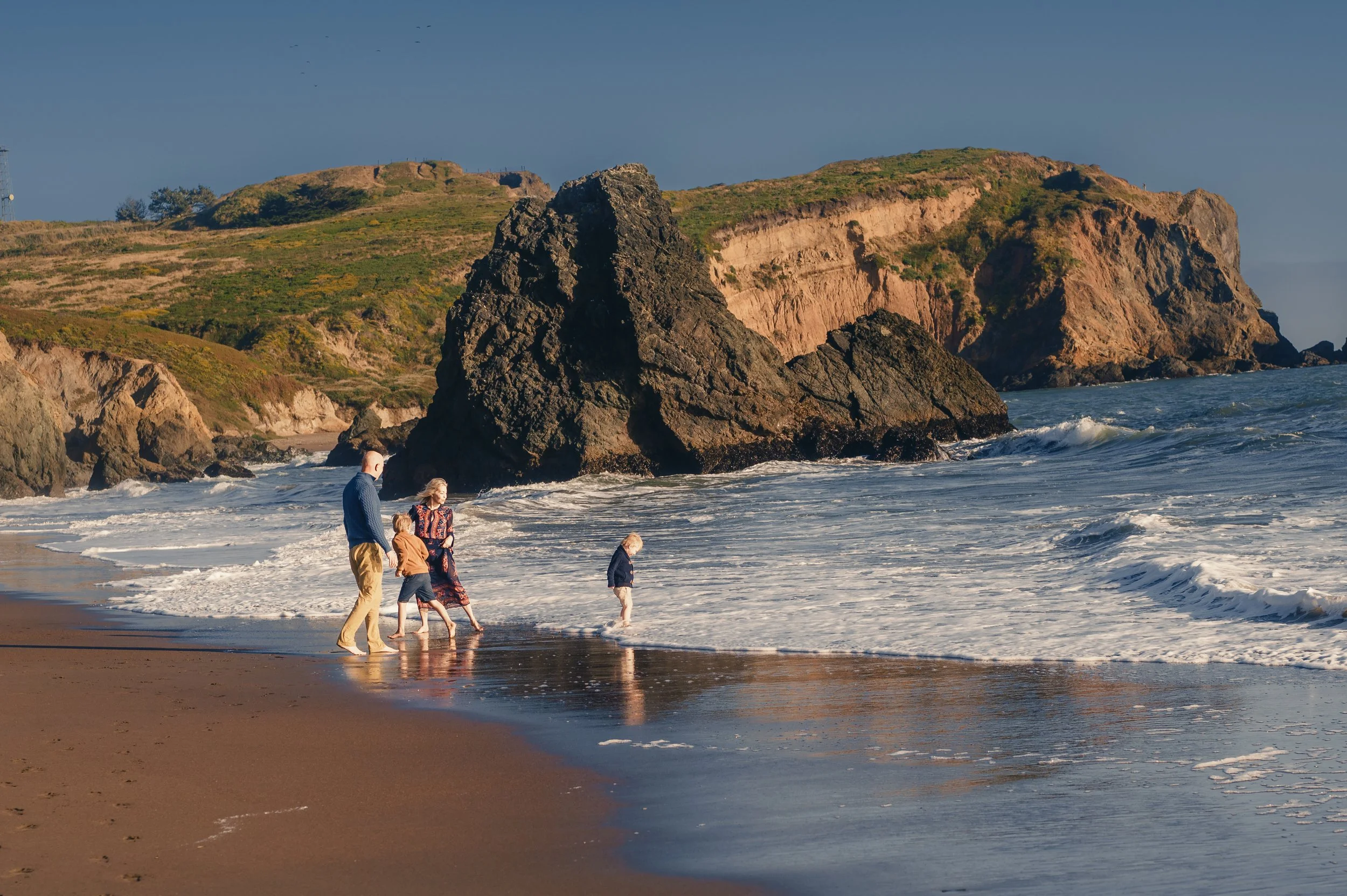 Family photos at Rodeo Beach in Marin County during a September fall session