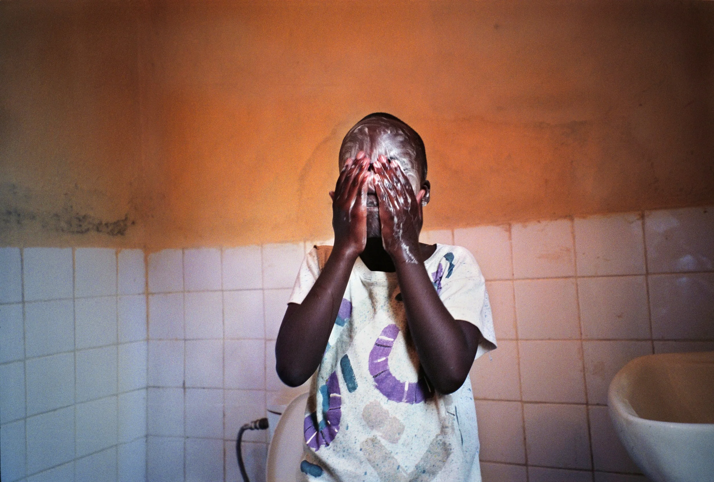Unuhoza Washing w-cap.jpg