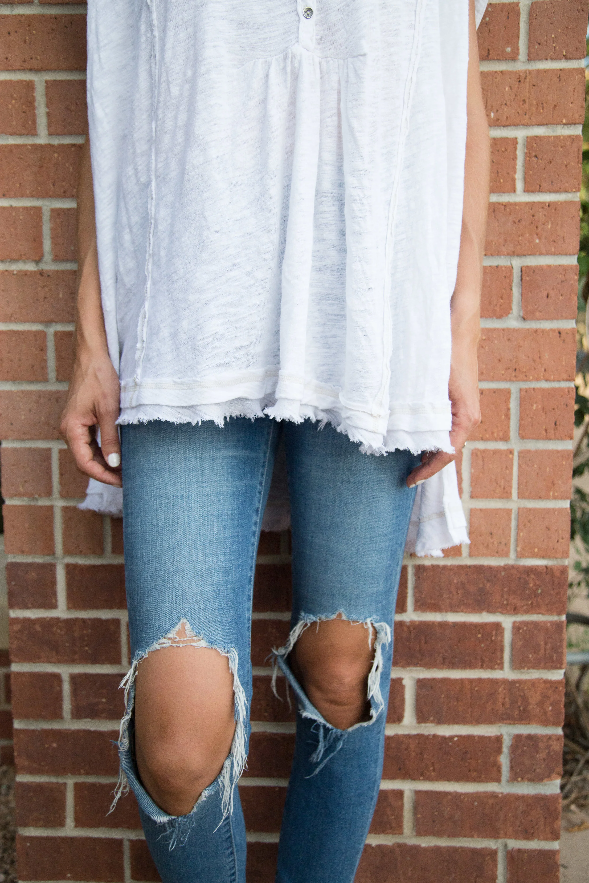 This is my most lived in pair of distressed denim. The 100% cotton holds their shape. I love how the knees are the only part that is distressed/has holes. When I first got them I was a bit worried that every day movement would cause the holes to get too big. Yes, they have gotten a little bigger but I like them just as much if not more now.