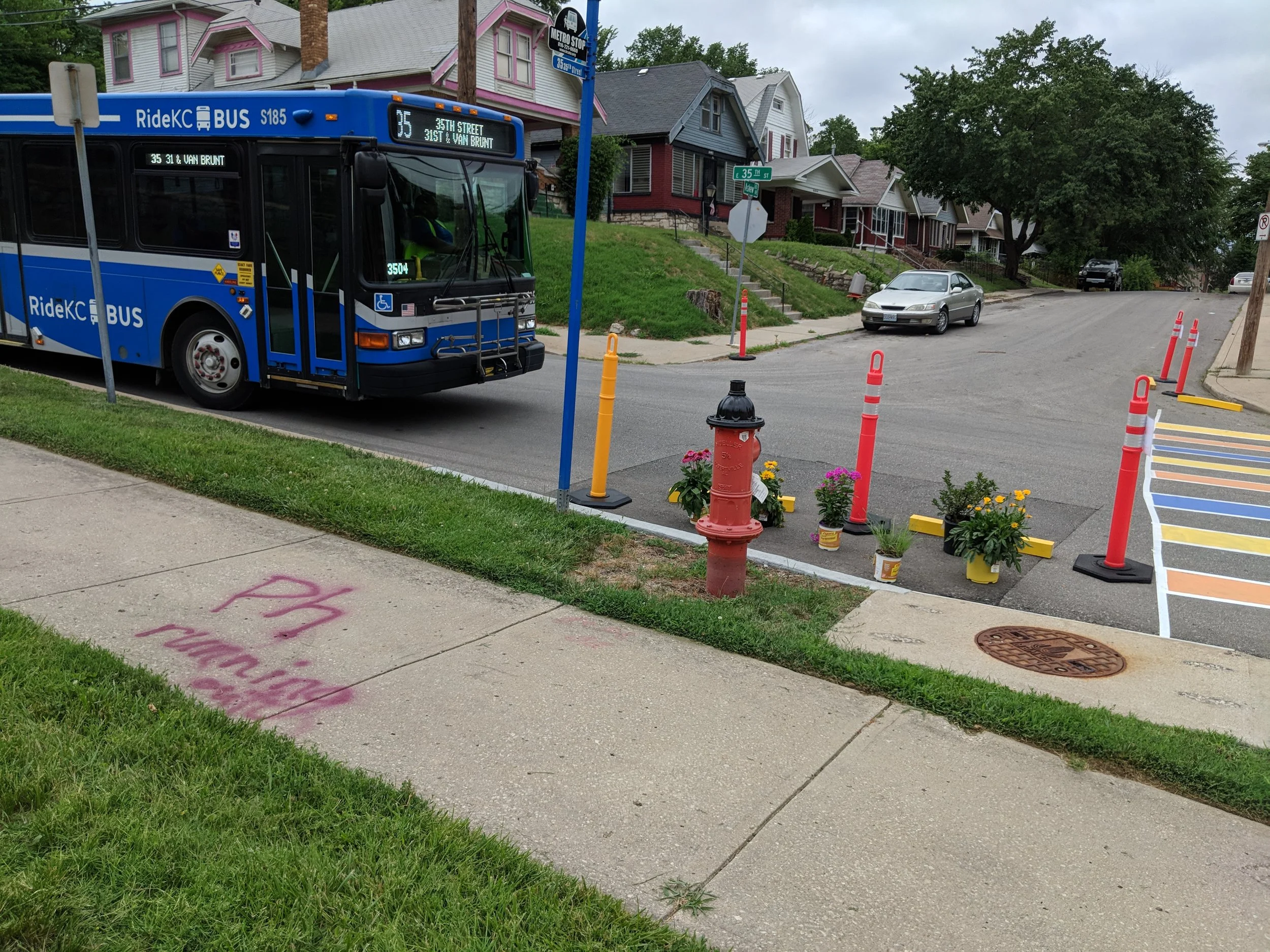 Sometimes infrastructure improvements as simple as a crosswalk can bring about big change. In the picture above you can see a temporary crosswalk and bus stop improvement my colleagues and I installed at the corner of 35th and Askew right next to the Palestine Missionary Baptist Church.