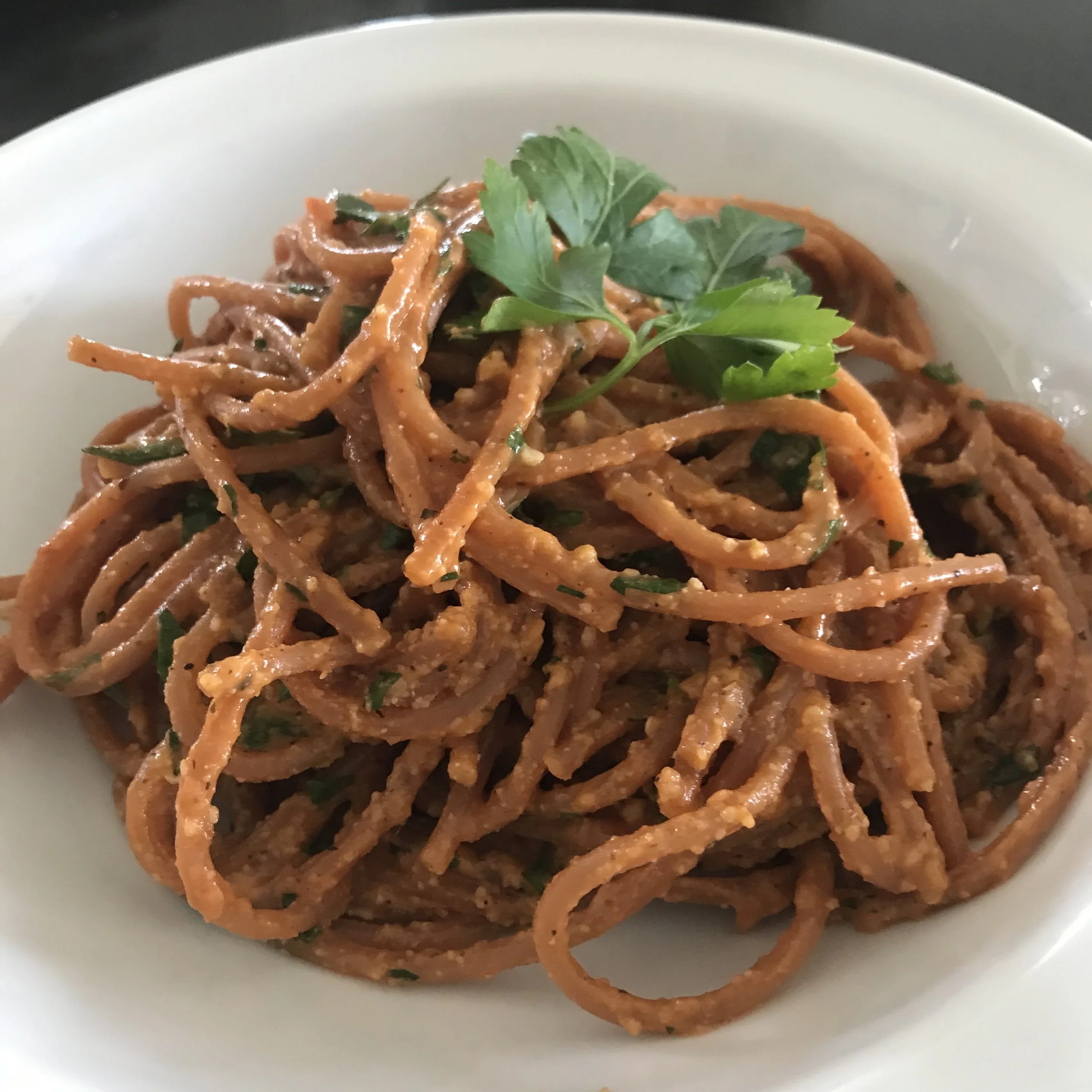 There is TONS of flavour in this Red Lentil Spaghetti With Anchovies, Garlic, Tomato and Cashew Nut 'Parmesan Cheese'