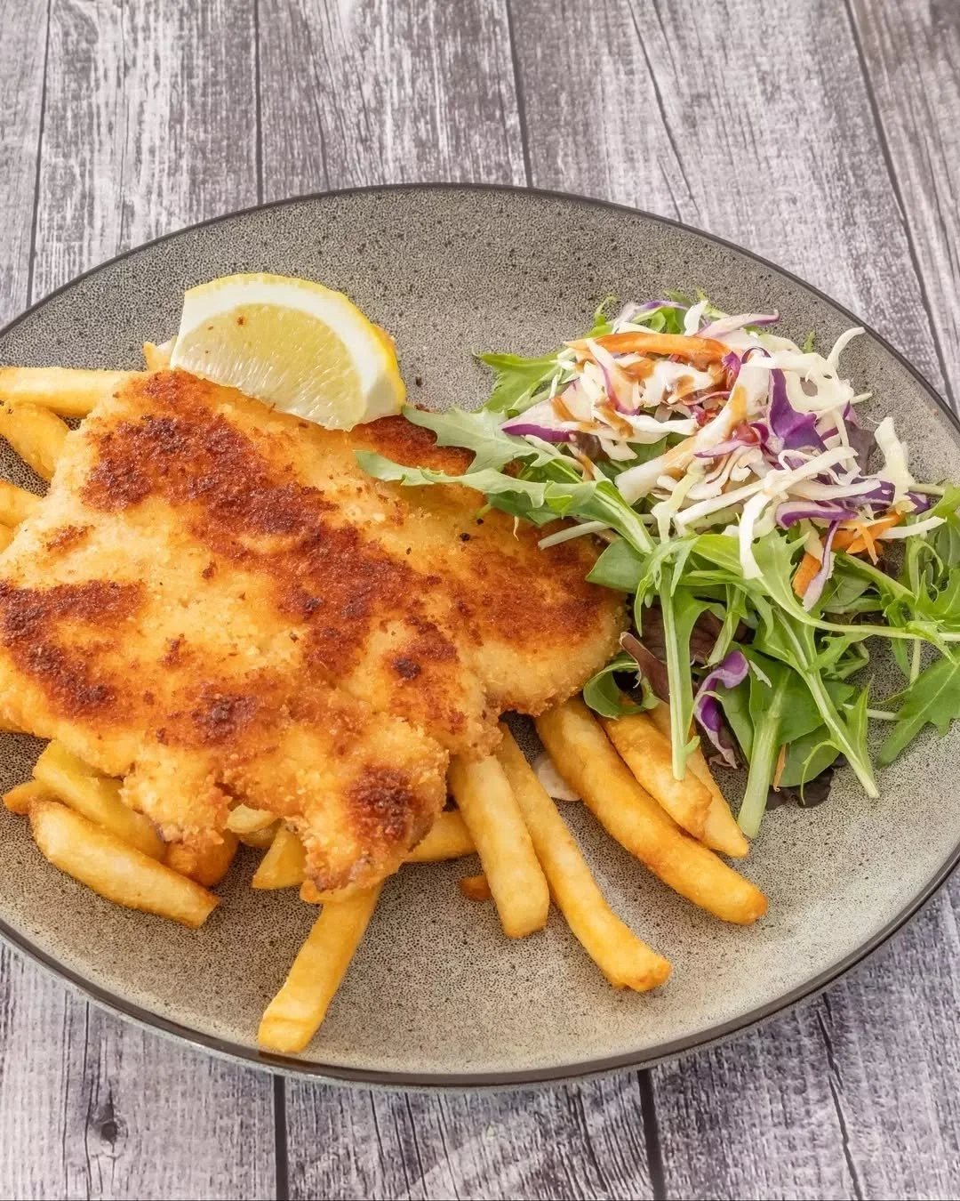 Some orders don&rsquo;t need a big sales pitch.

A herb crumbed schnitzel, pan-fried til golden, served with chips and finished with a squeeze of lemon.

Reliable, satisfying, and a far better end to the day than another sad desk lunch. 🍋