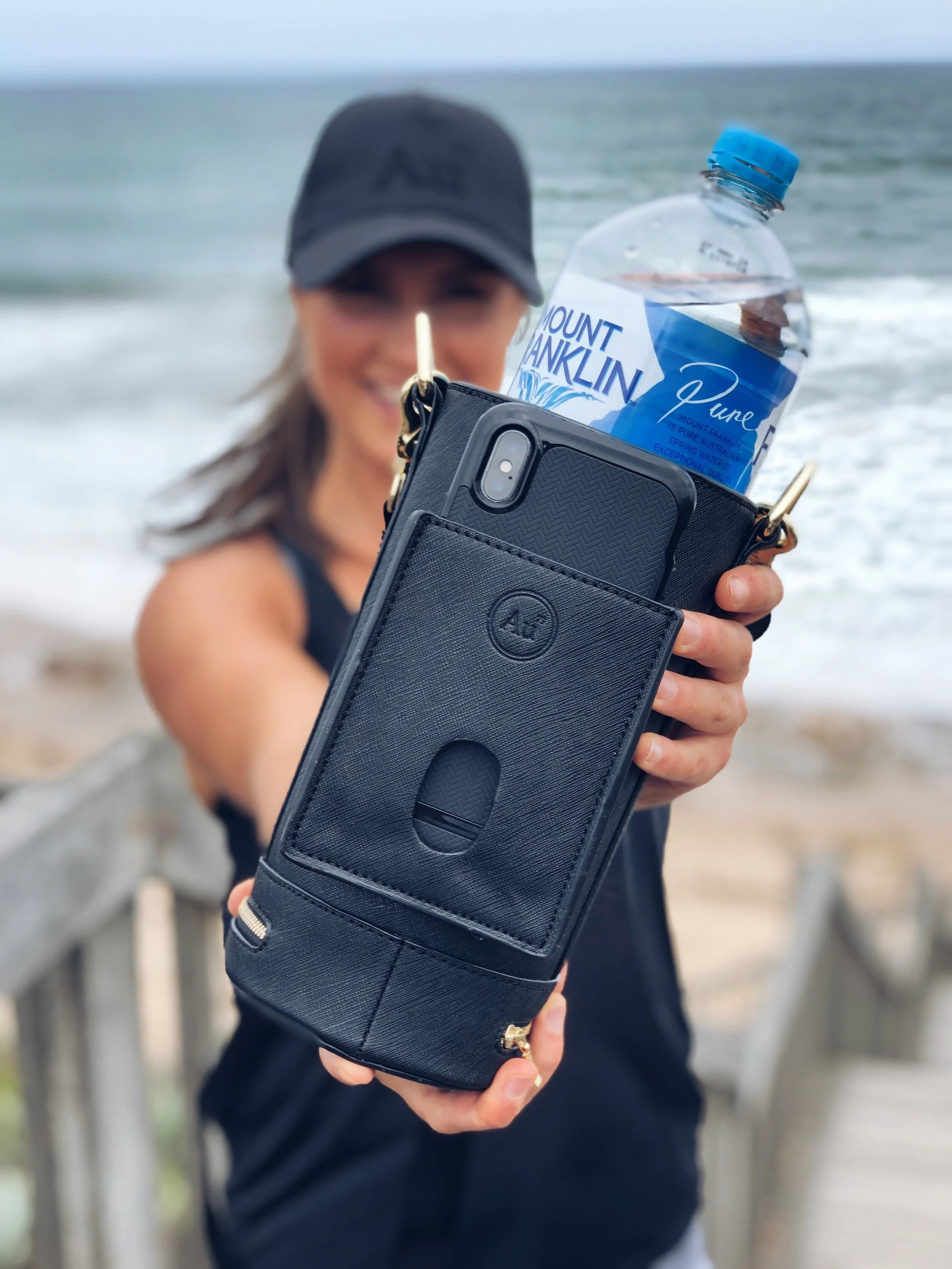 Compact water bottle bag. Carries mobile, phone, keys, money, drink bottle, water. — AU79