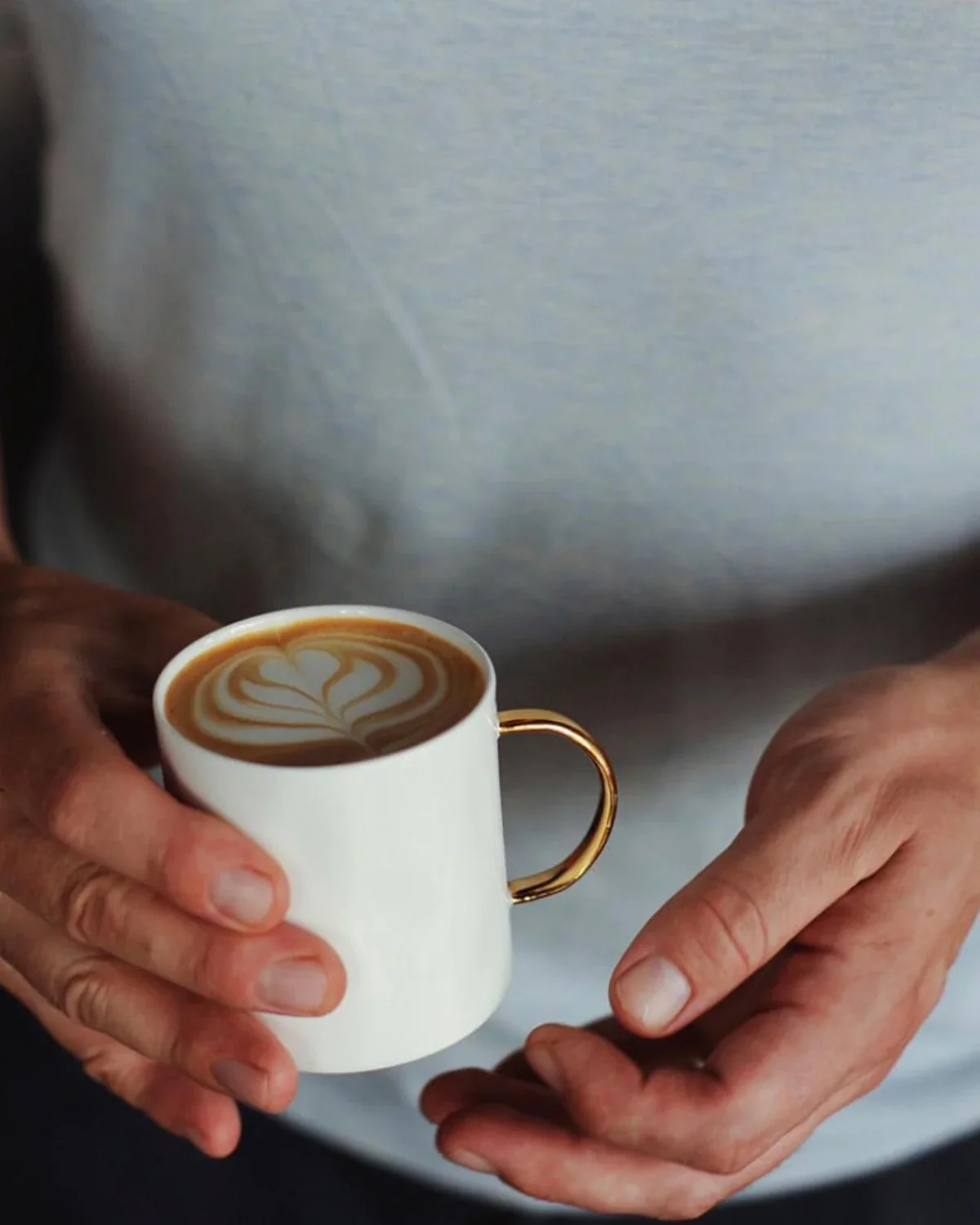 Coffee Mug 7oz Gold handle with hand.jpg