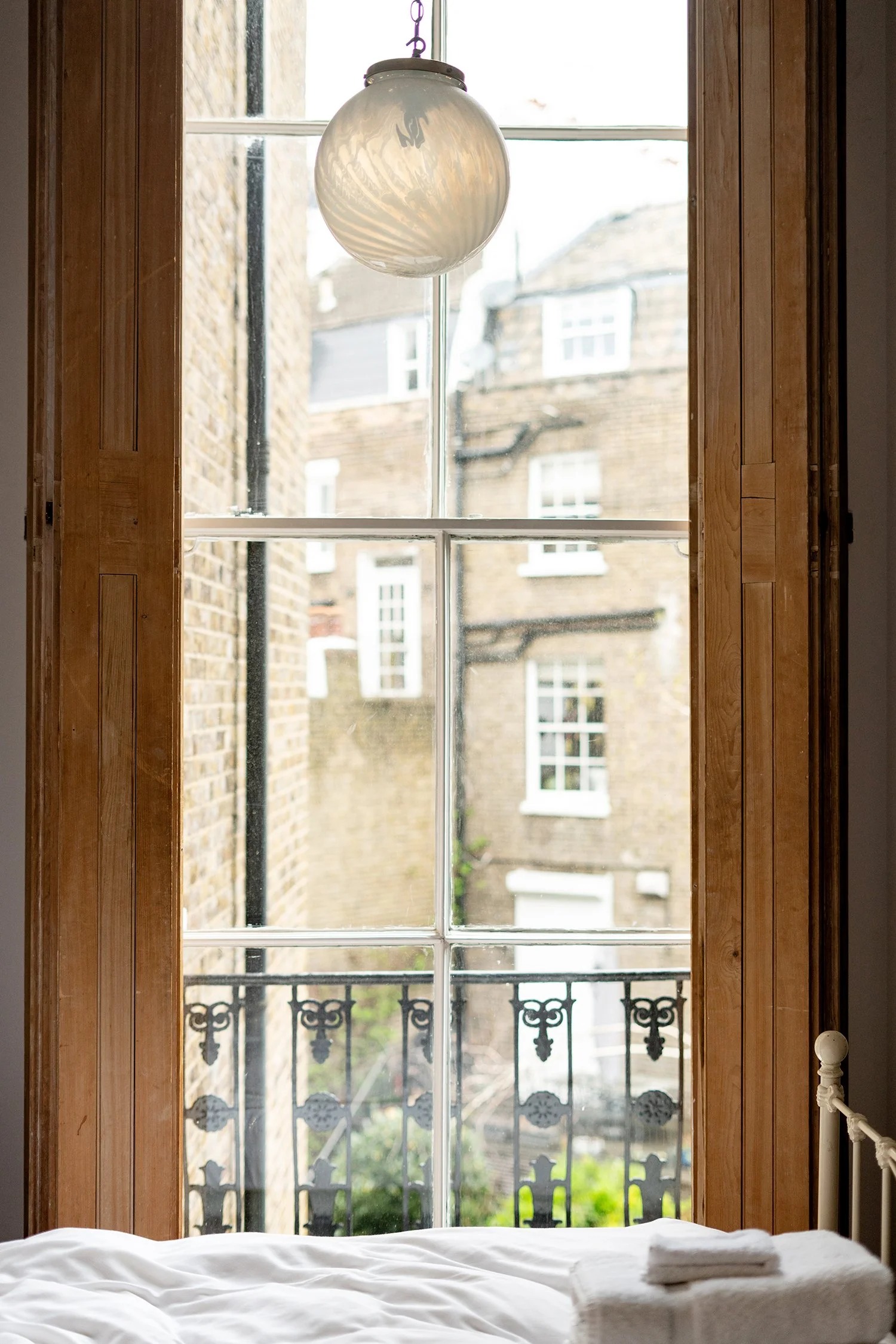 One Fine Stay UK Easter 2023 bed and windows.jpg