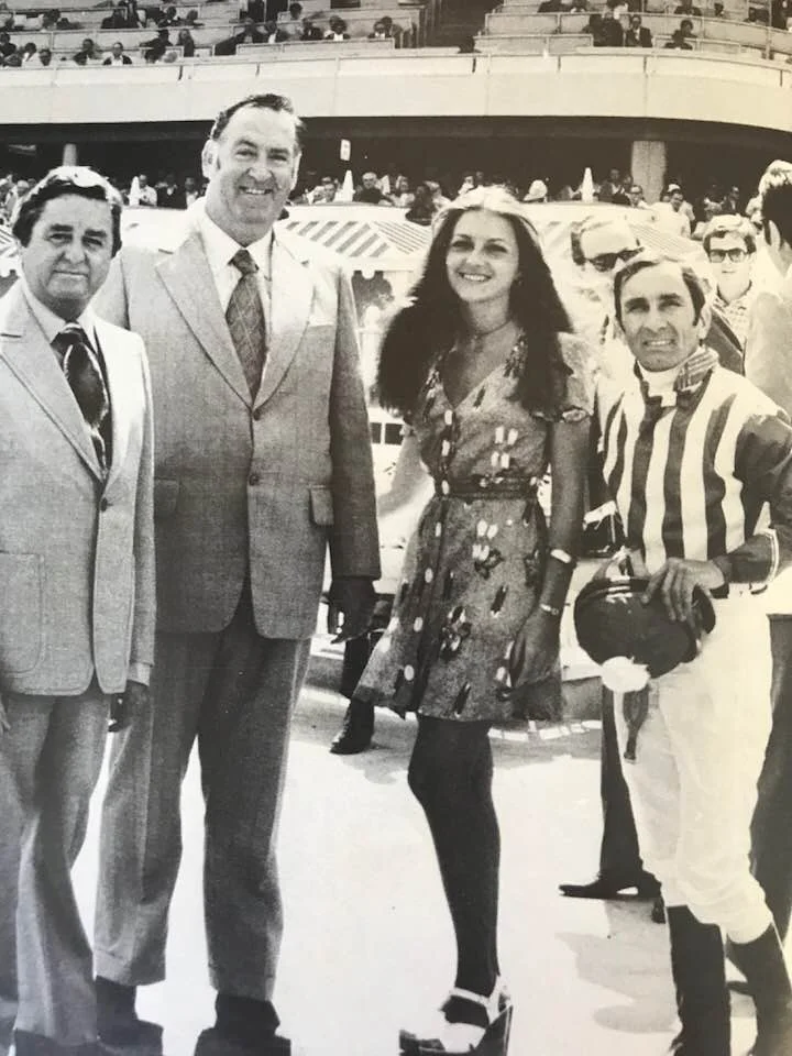 Image from 'The Bert Bryant Story' by Neill Phillipson. Published: 1978. Bert Pictured with friends at Hollywood Park in the USA. 