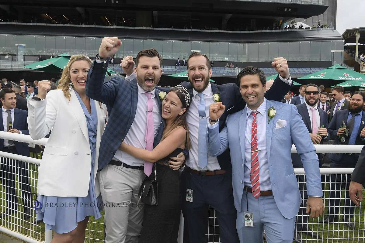 Image courtesy of Bradley Photographers - Winners are grinners. Belflyer slot holders.