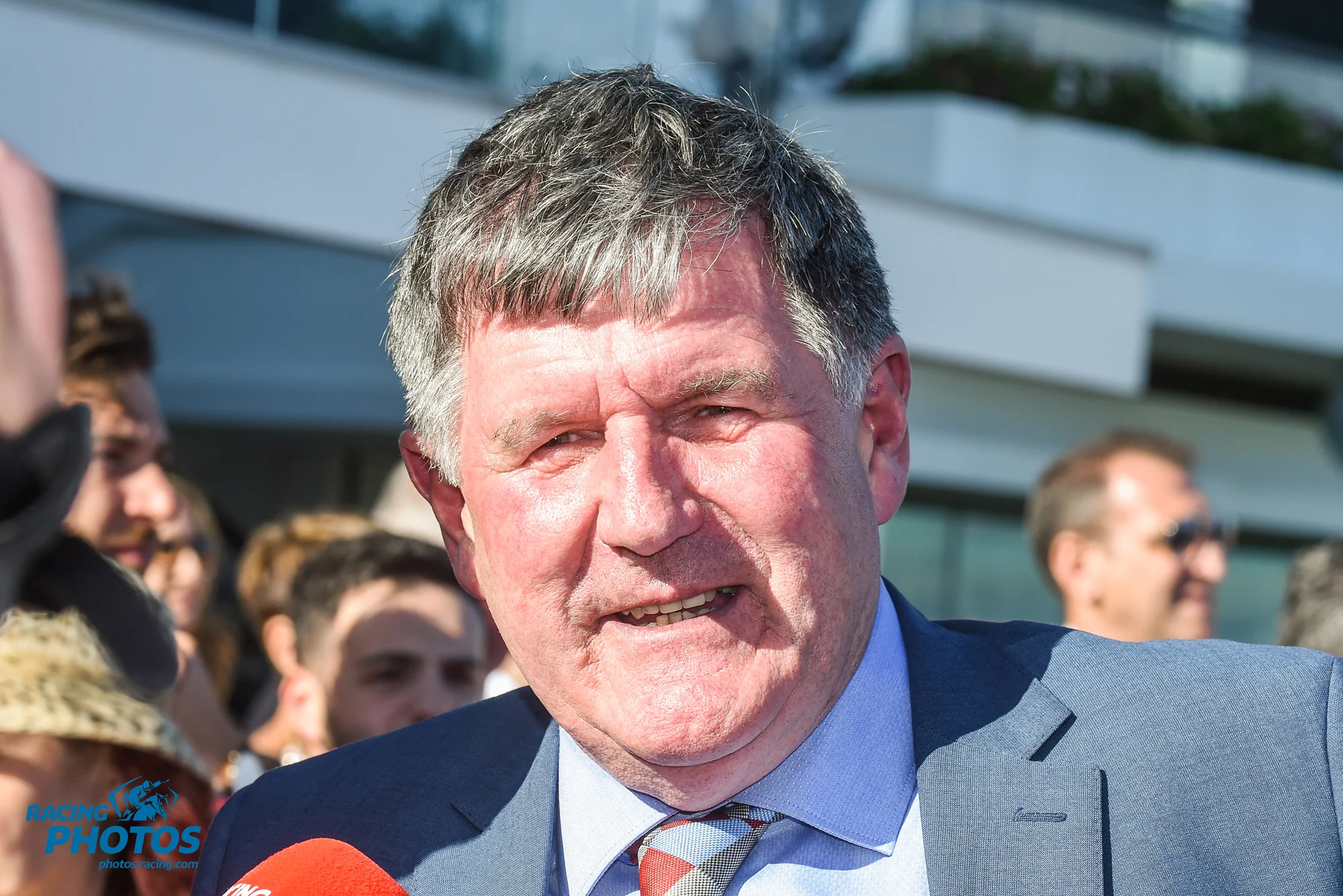 Image courtesy Racing Photos - John Sadler chats with owners at the track.