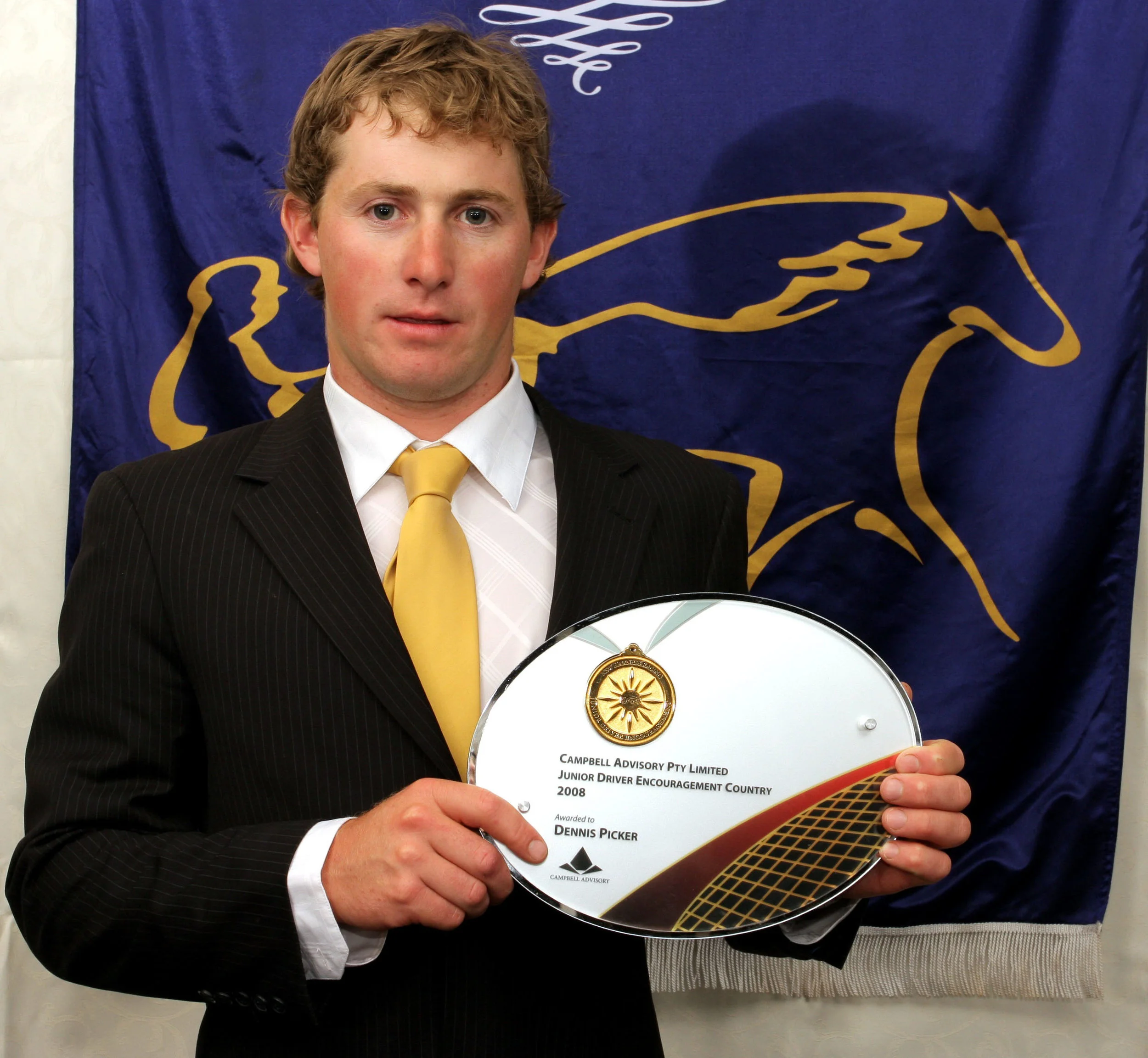 Image courtesy National Trotguide - Dennis, at age 22, receiving the Country Junior Drivers Encouragement Award.
