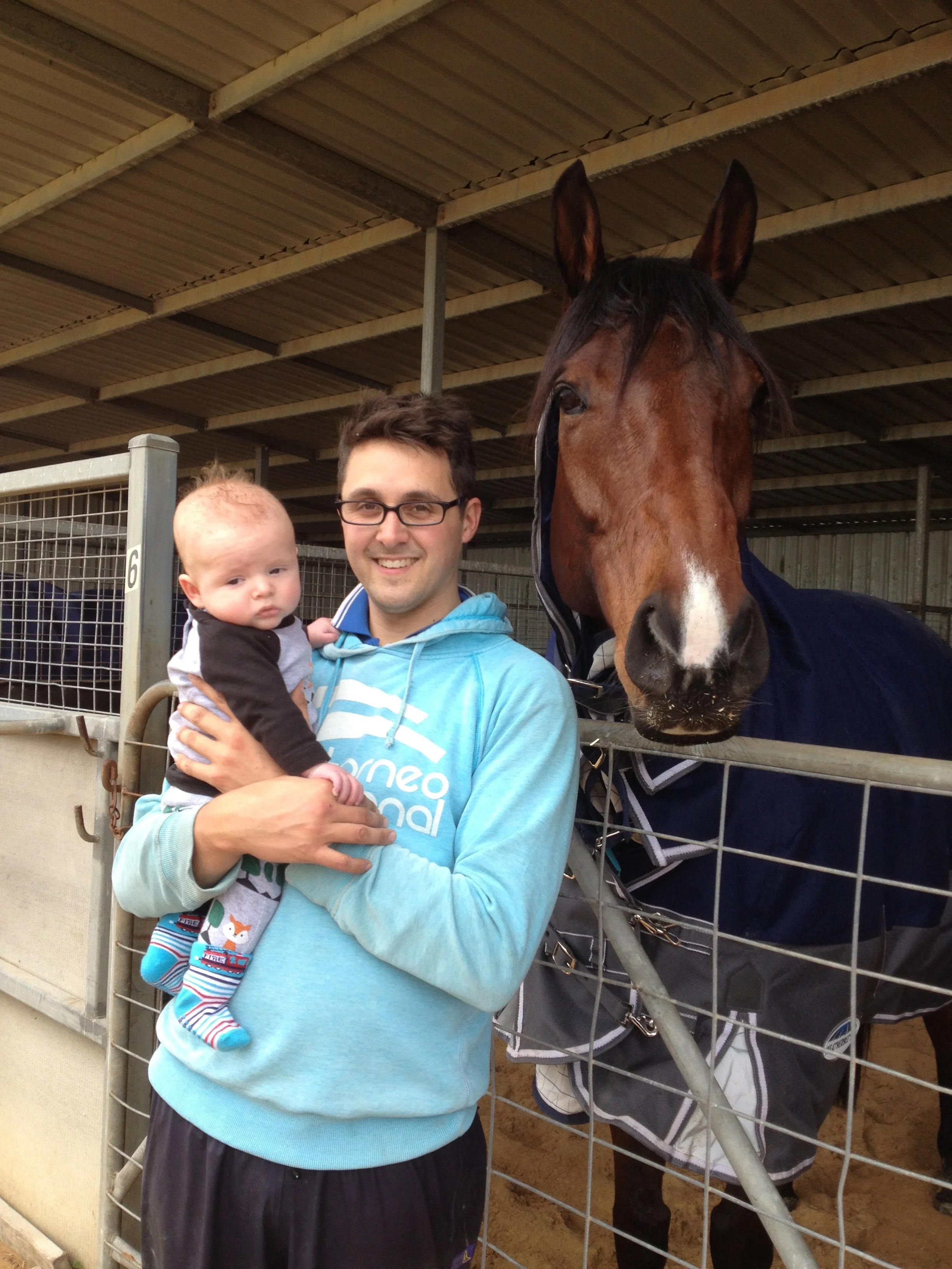 Daniel with young son Charlie and Rain Affair.