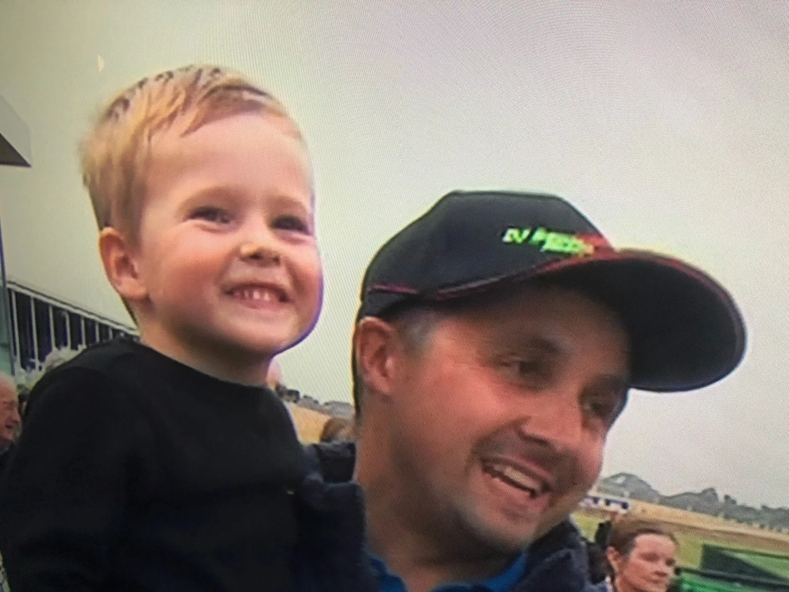 Dad teaches Charlie how to be humble in the winners circle.