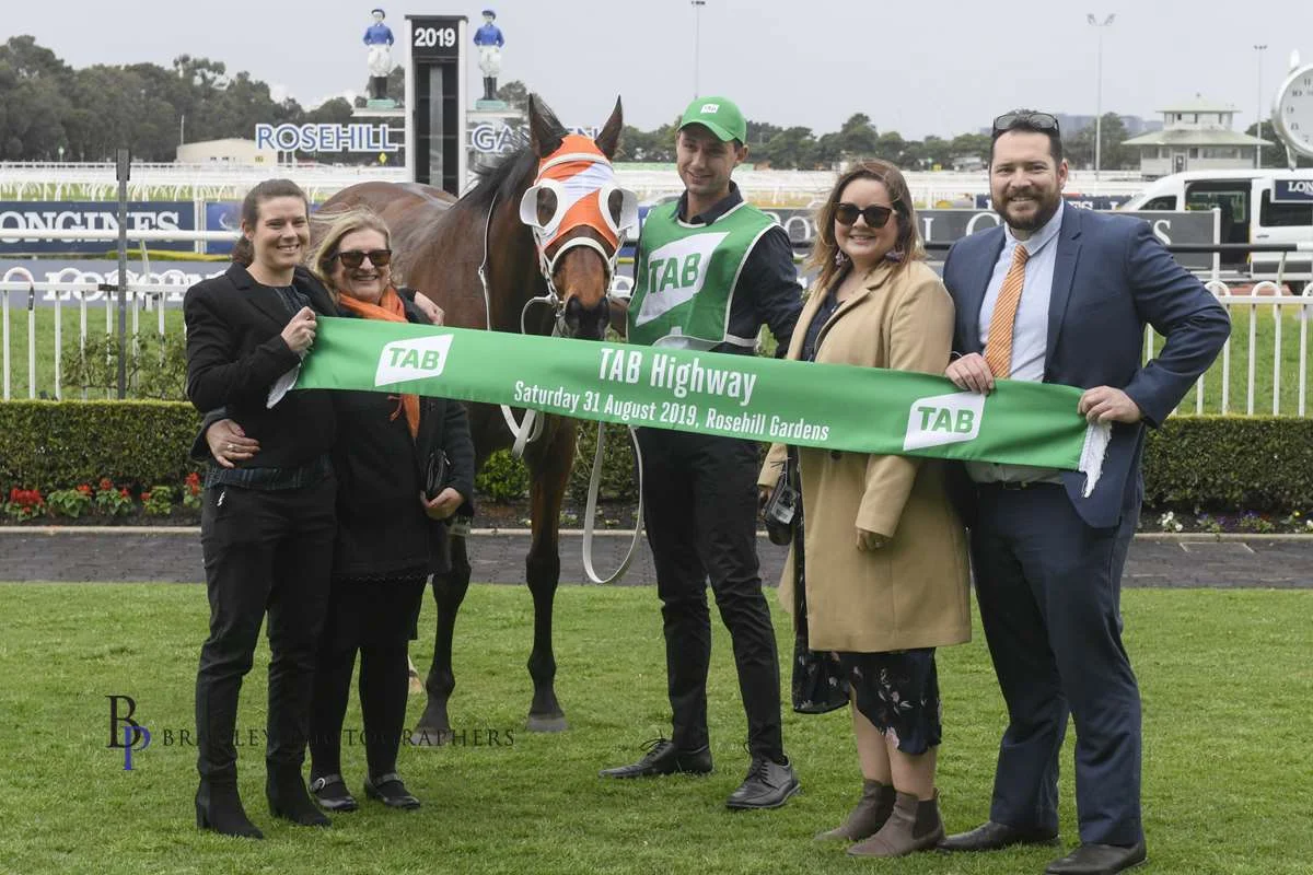 Image courtesy Bradley Photographers - All in the family. From left Danielle, Julie, Ellen and David. Aaron Day has charge of the winner.
