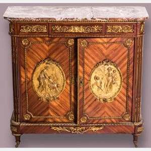 A Louis XVI Style Tulipwood Cabinet with Rouge Marble Top and Ormolu Mounts by Befort Jeune (Mathieu Befort, 1813-1880). Sold $10,000