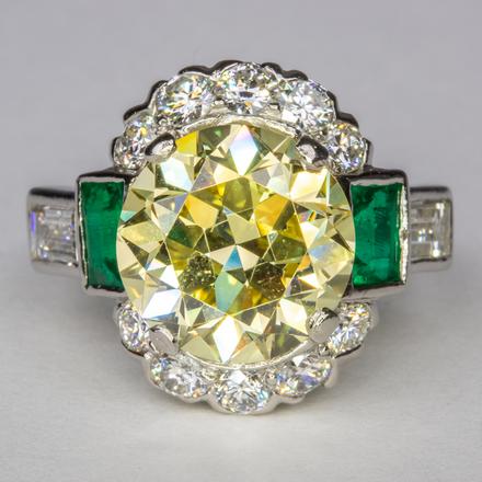 Fancy Yellow Diamond & Emerald ring. Estimated at $35K - $45K, sold for $55K