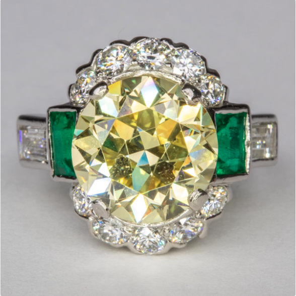 FANCY-YELLOW-DIAMOND-AND-EMERALD-RING.png