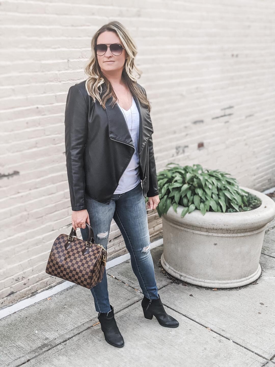 Outfit: Louis Vuitton Speedy & Brown Leather Jacket at Skyline
