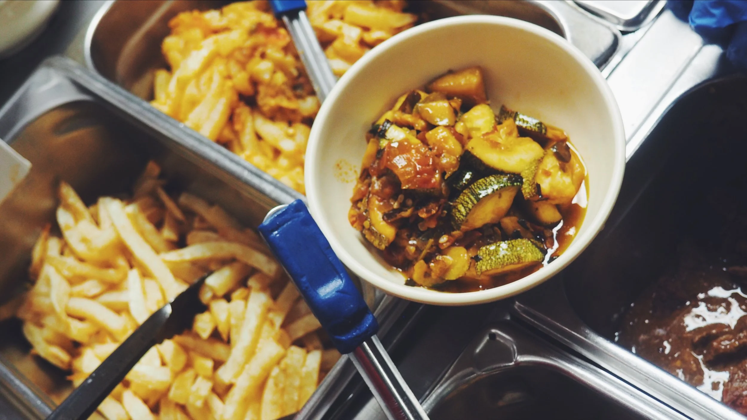 Our vast array of options; pictured here is our Calabacitas, along with our Papas Rancheras.