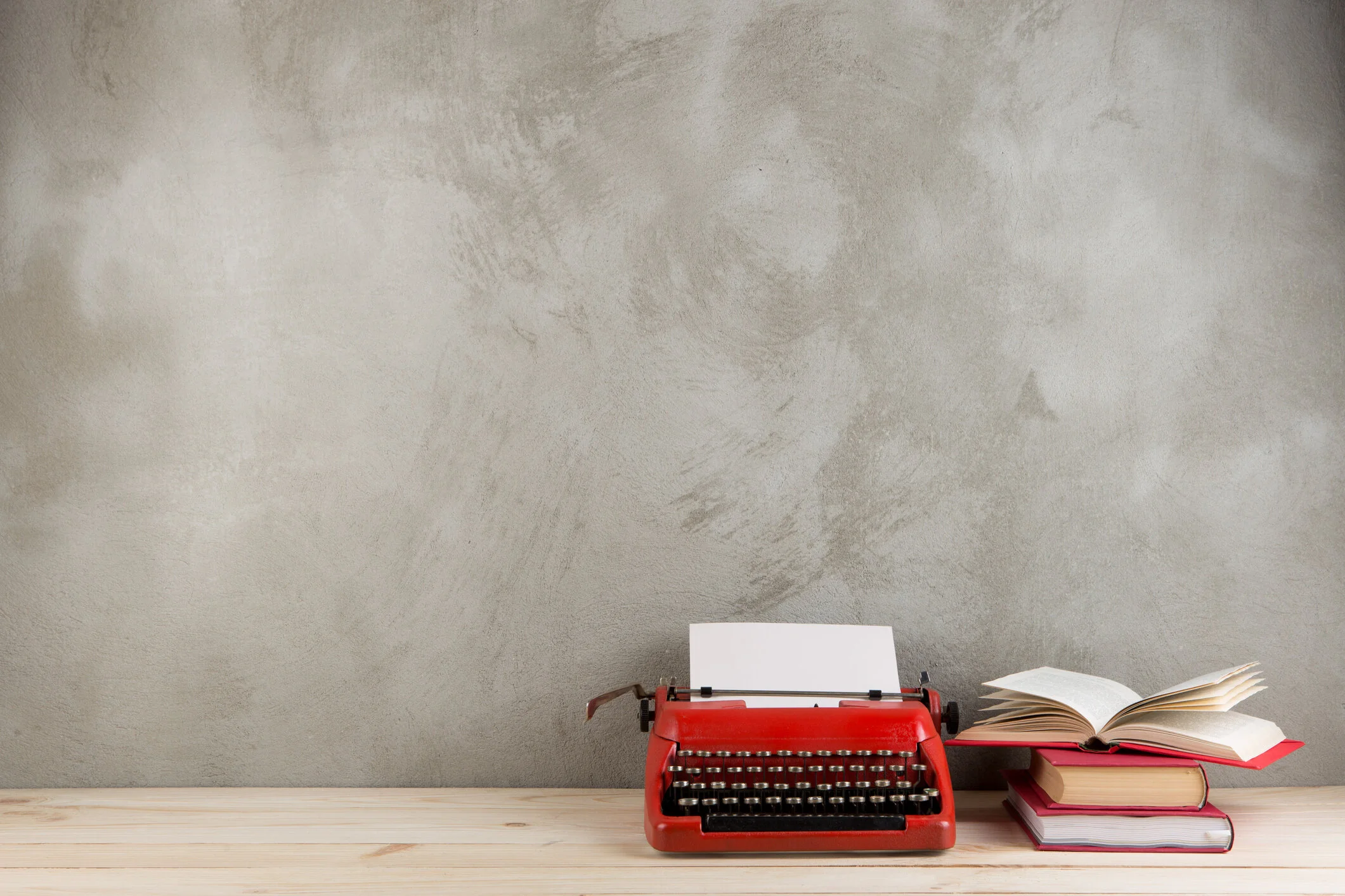 typewriter on grey with books.jpg