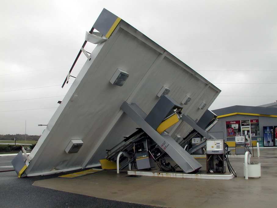 KITTY HAWK, N.C., September 1, 1999 -- Hurricane Dennis packed a lot of winds that caused some damage in the Nags Head area, as with this Shell Gas Station canopy along Virginia Dare Trail, crushing the gas pumps beneath it. Photo by DAVE GATLEY/FEMA News Photo Photo by Dave Gatley - Aug 31, 1999 - Location: KITTY HAWK, NC