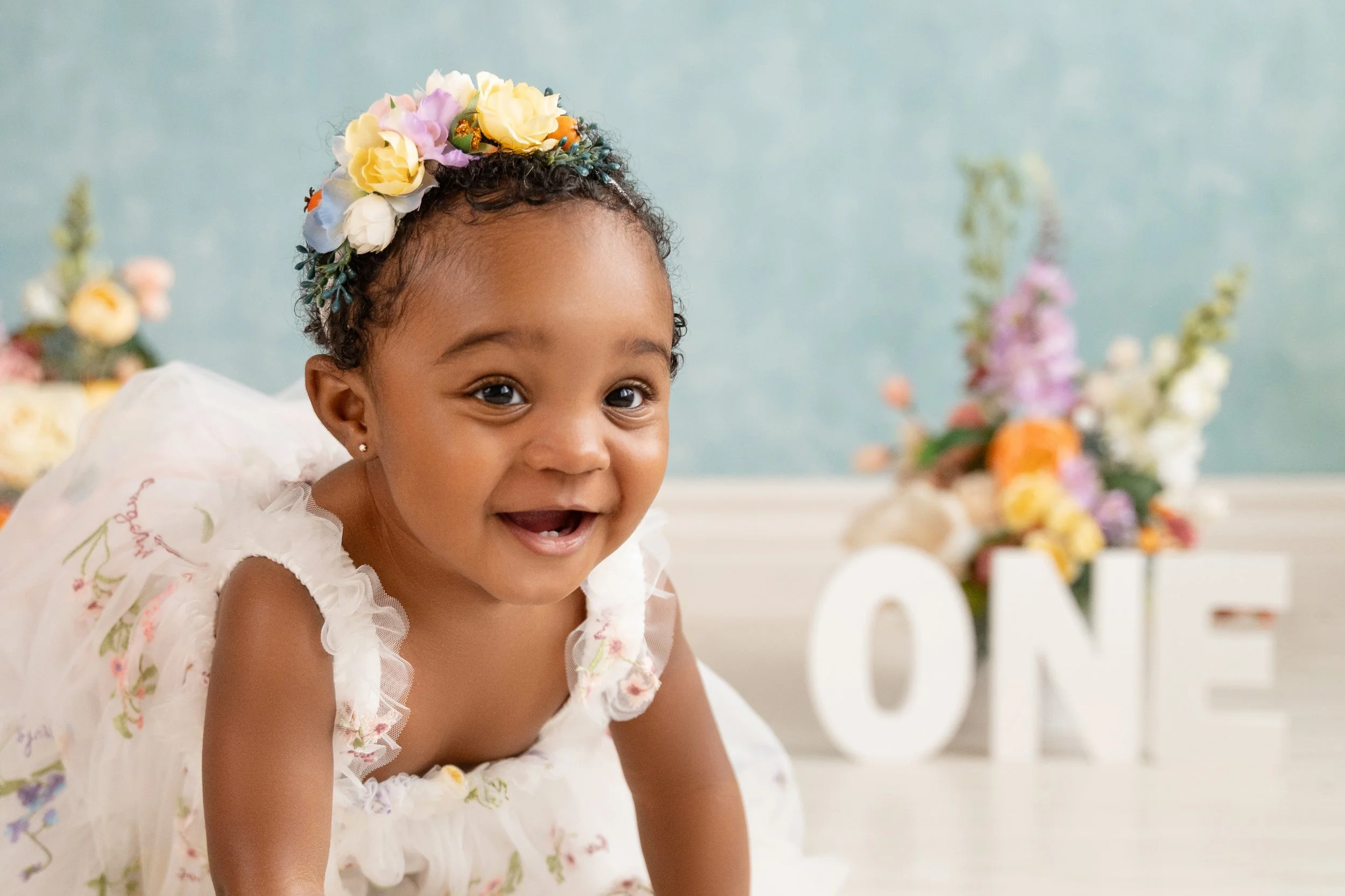 Studio portrait of one-year-old Ava capturing her personality.