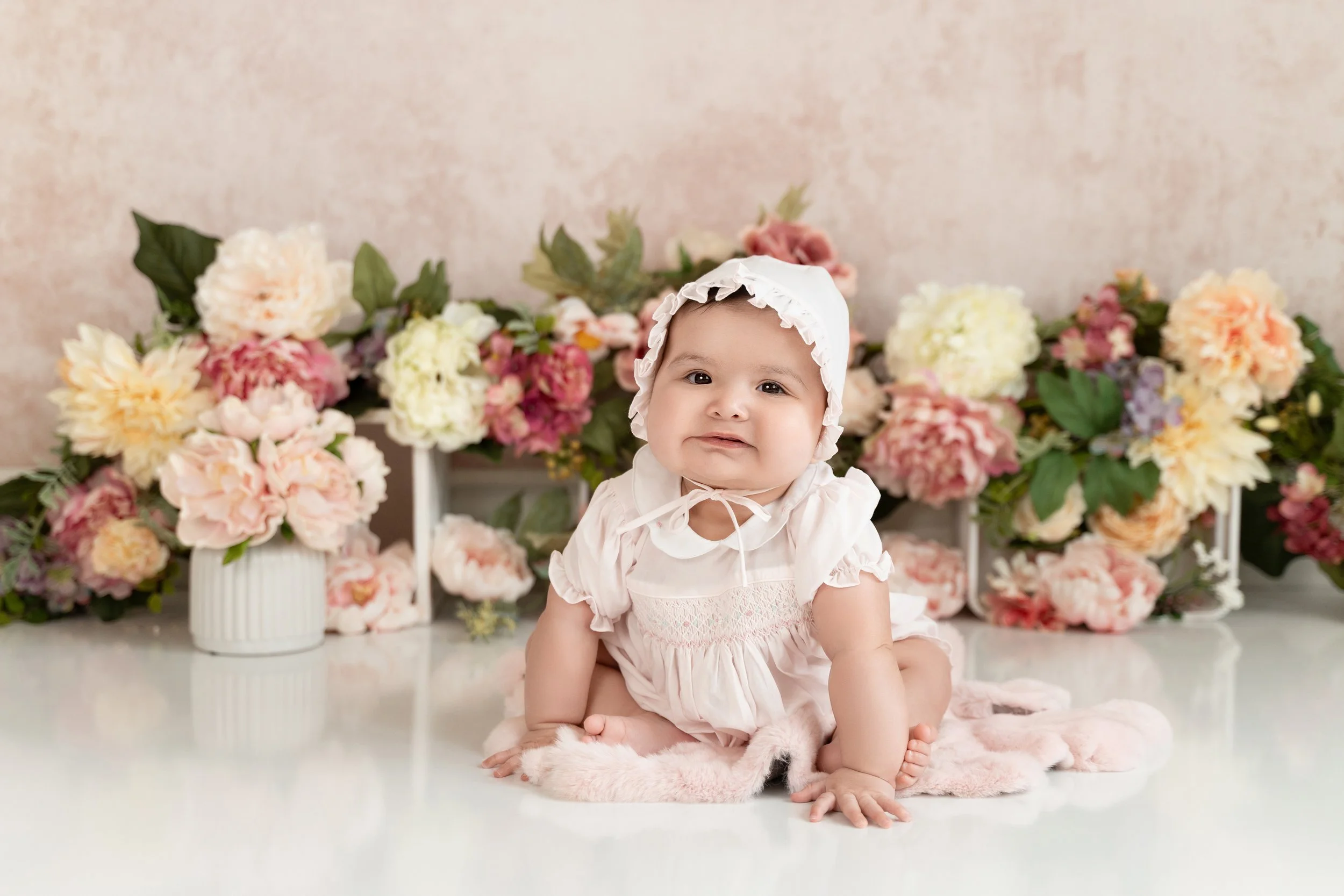 6-month-old Presley smiling during her milestone photography session in Cypress