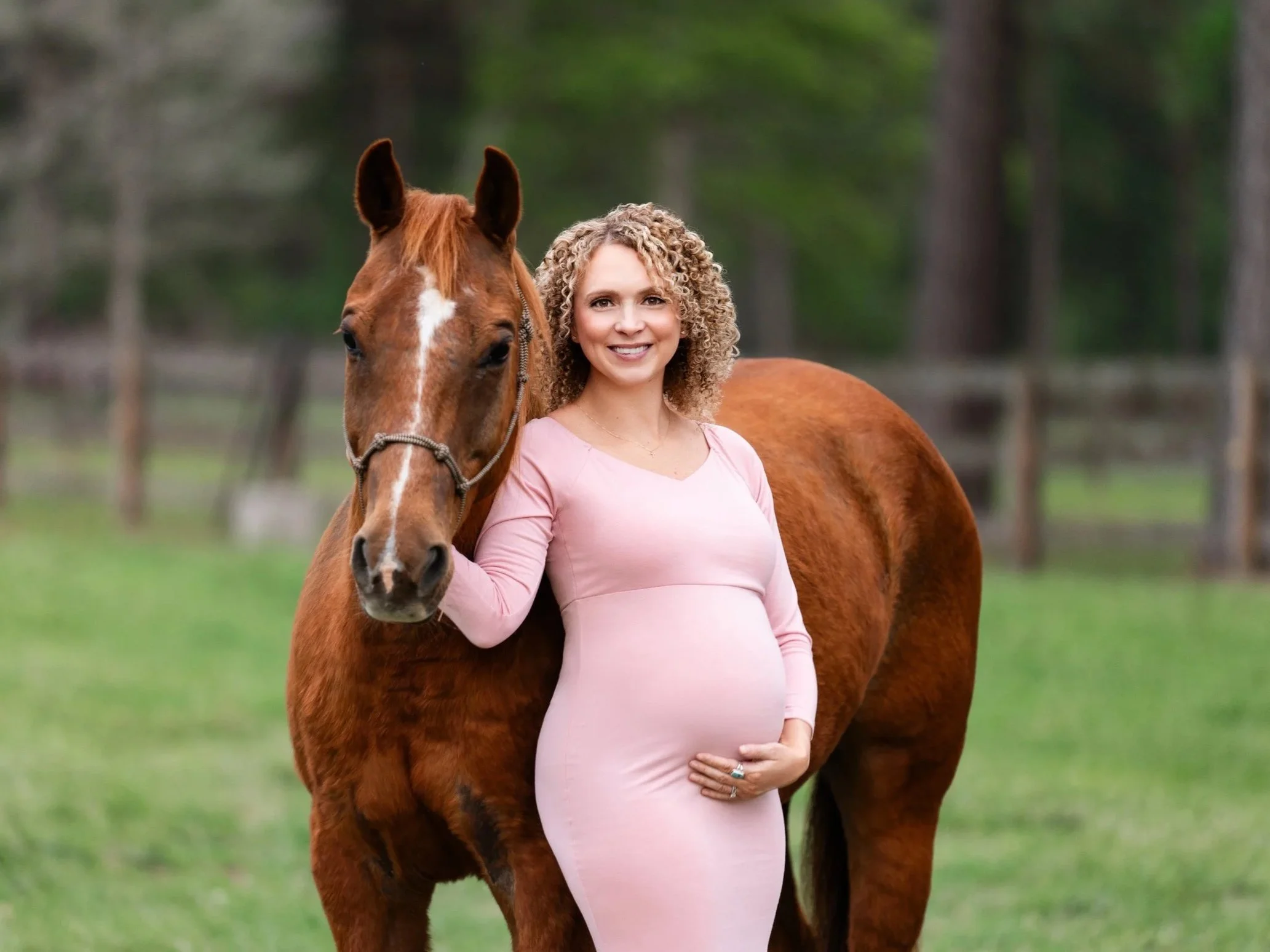 Doc the horse with maternity mom in pink dress