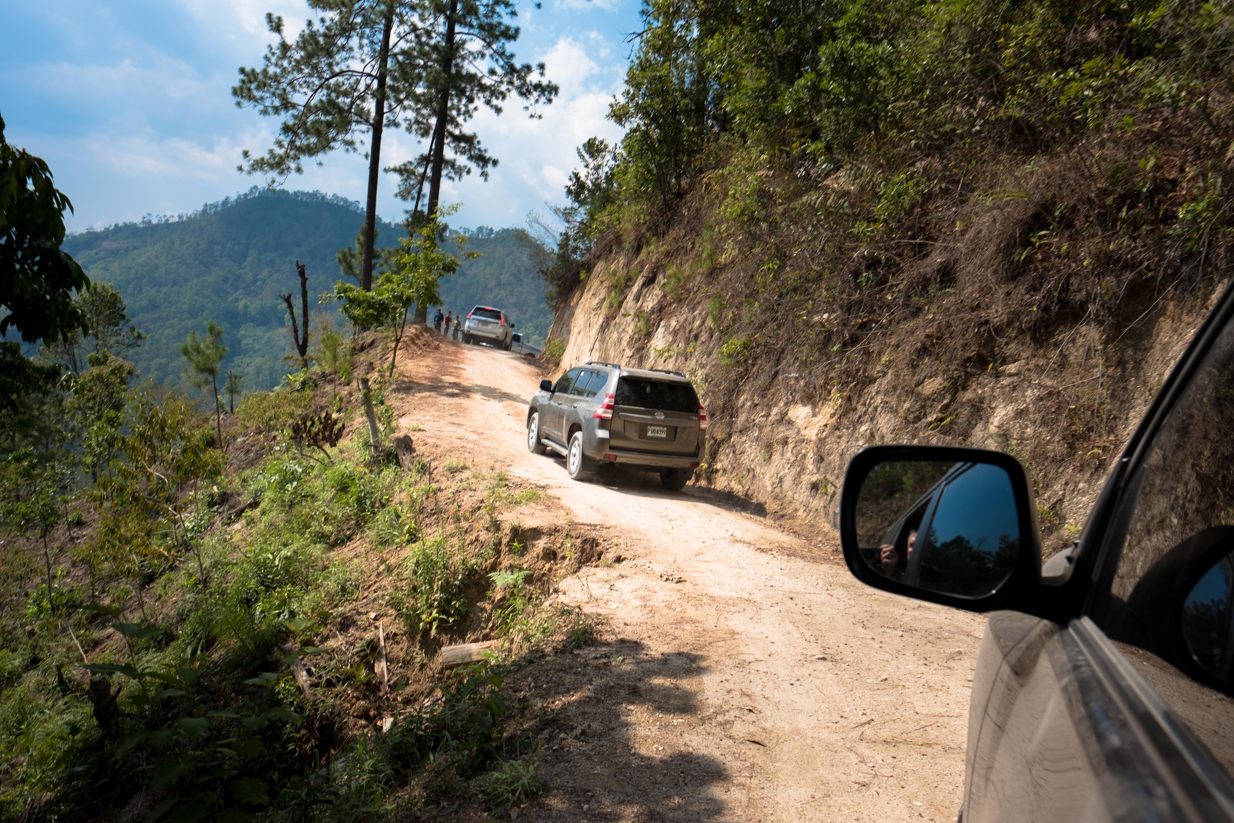 Honduras 18 day 2_SUVs on steep road 2.jpg