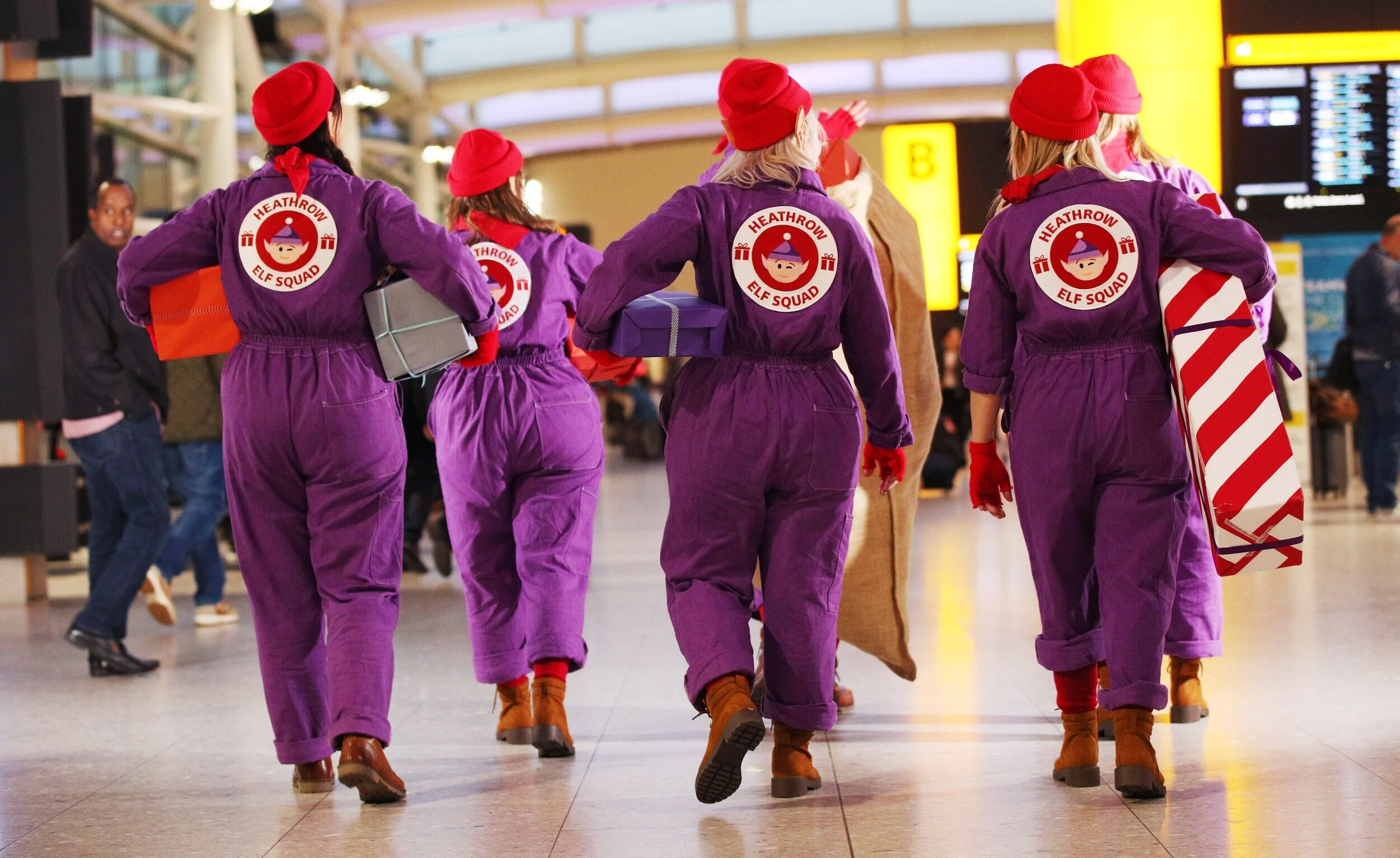 Heathrow+Christmas+Elf+Squad_in+terminal_backs_for+Monday+2+December+2019.jpg