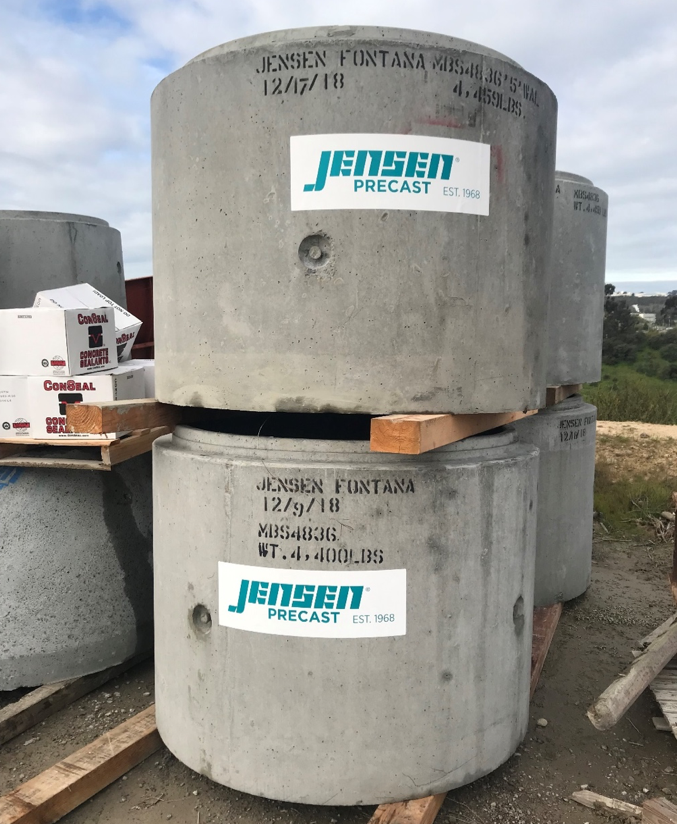 A single deep sump tank from Jensen Precast has a 200-gallon capacity, weighs 4400 pounds, and must be lowered into place by a crane.