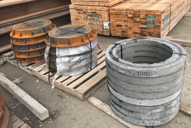 After the precast basin is installed as the sump tank, a cone and rings will be placed on top, bringing the unit to ground level. A metal lid will then be added and the sump tank will appear as a manhole.