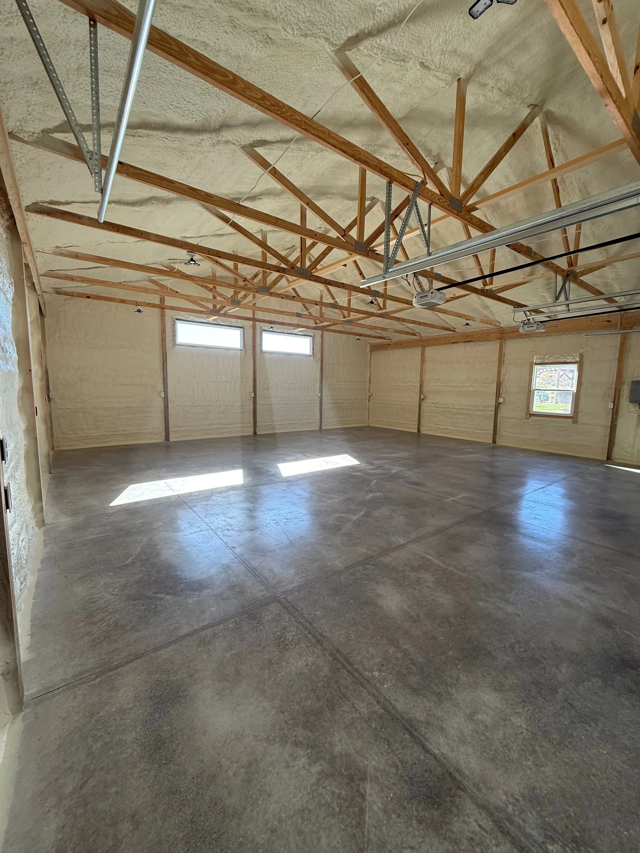   spray foam insulation applied to roof trusses and all interior walls of a large residential garage — Summit Sprayfoam, central Ohio