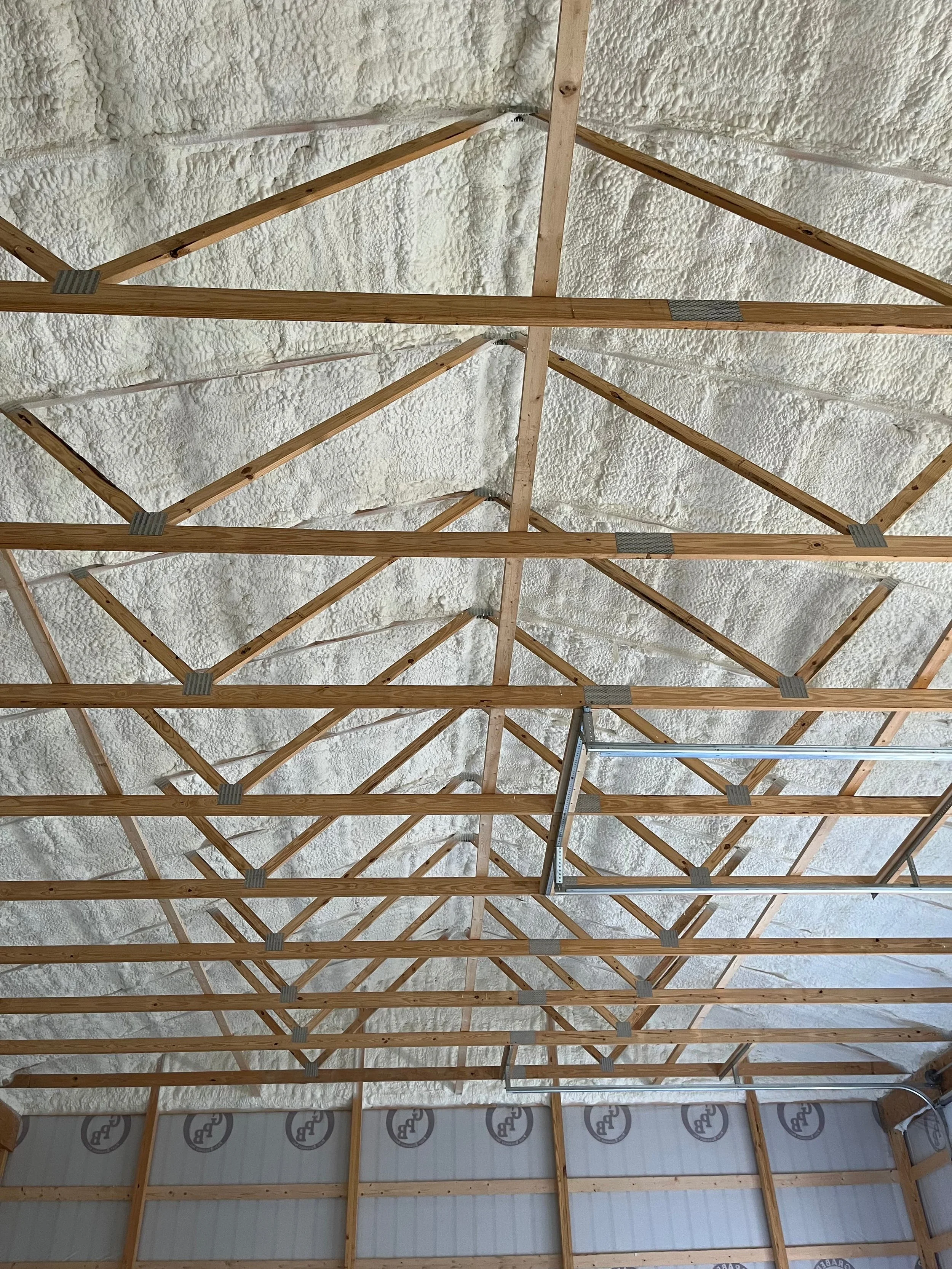 spray foam insulation contractor applying foam to vaulted ceiling and walls of a large commercial building — Summit Sprayfoam, Ohio