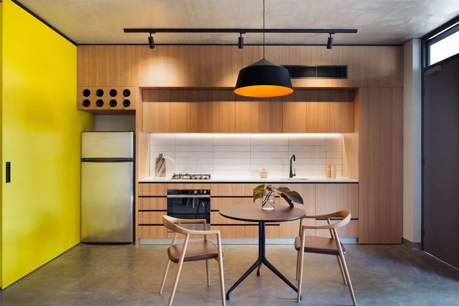 Large black Circus pendant designed by Corinna Warm for Studio Warm at Coppin Street apartments by Musk Architecture