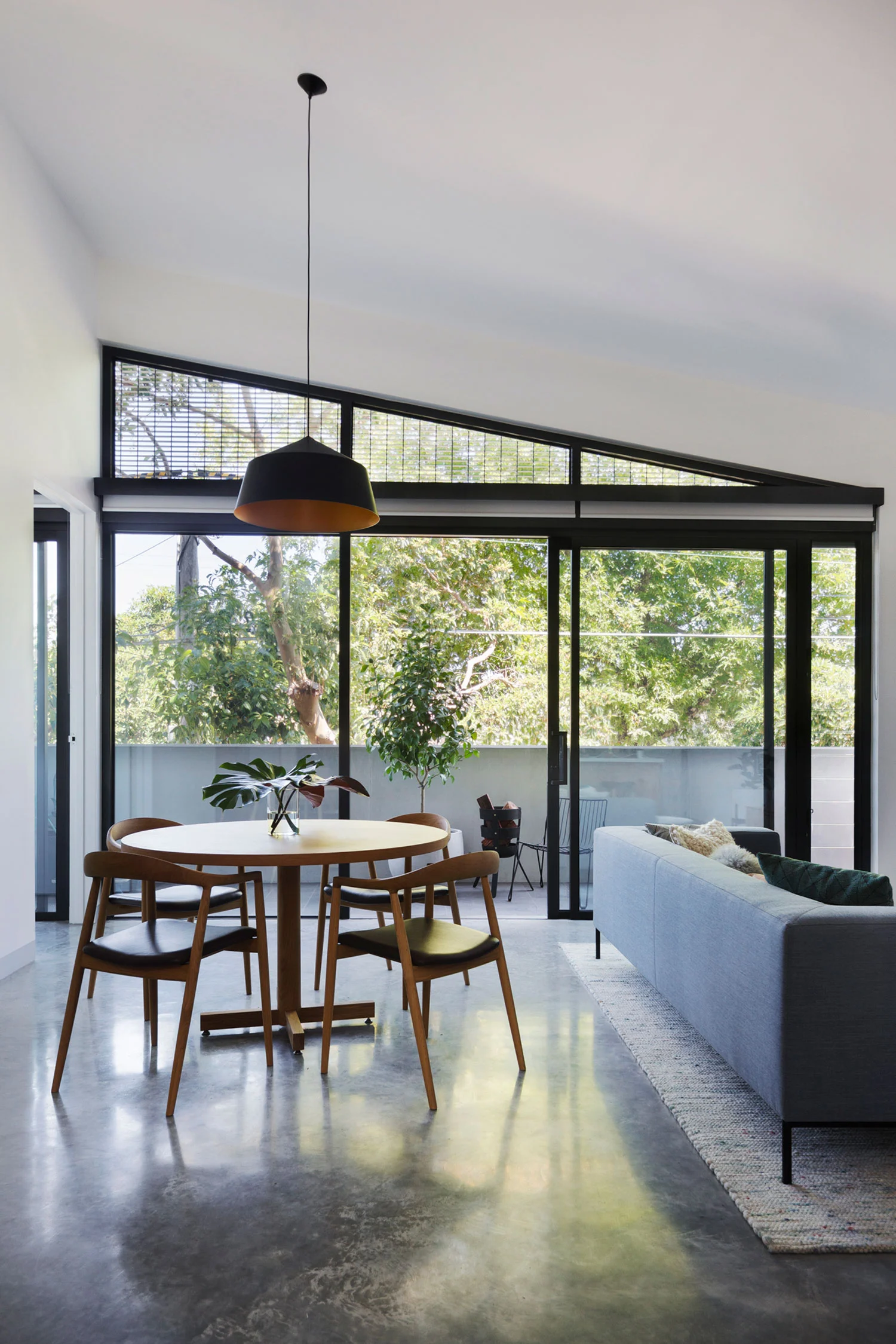 Large black Circus pendant designed by Corinna Warm for Studio Warm at Coppin Street apartments by Musk Architecture