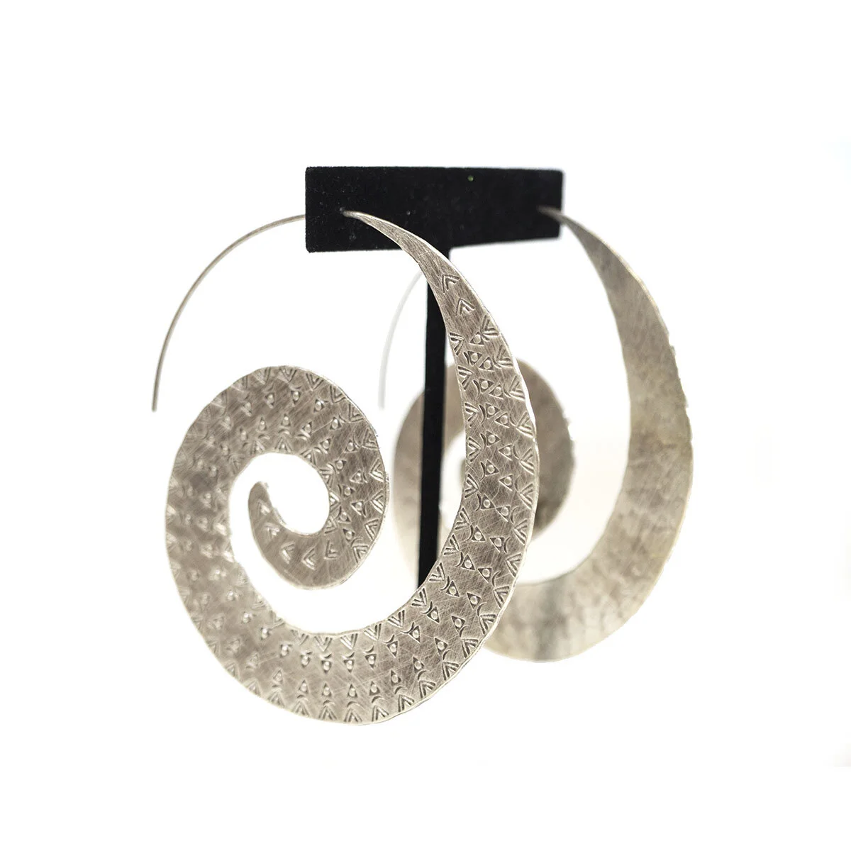 Silver spiral earrings, side view