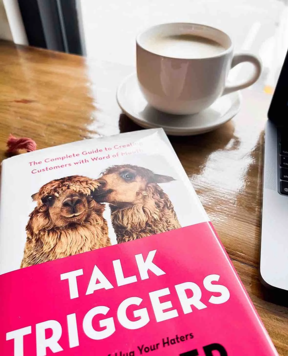 Coffee and book on table at coffee shop
