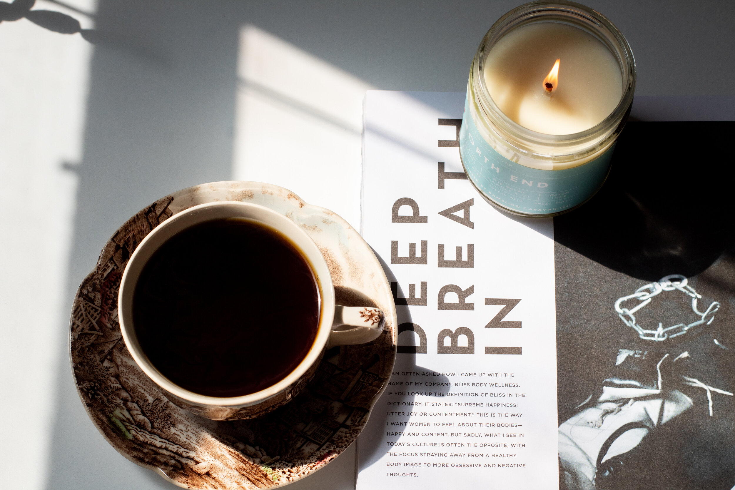 candle and coffee in tea cup.jpg