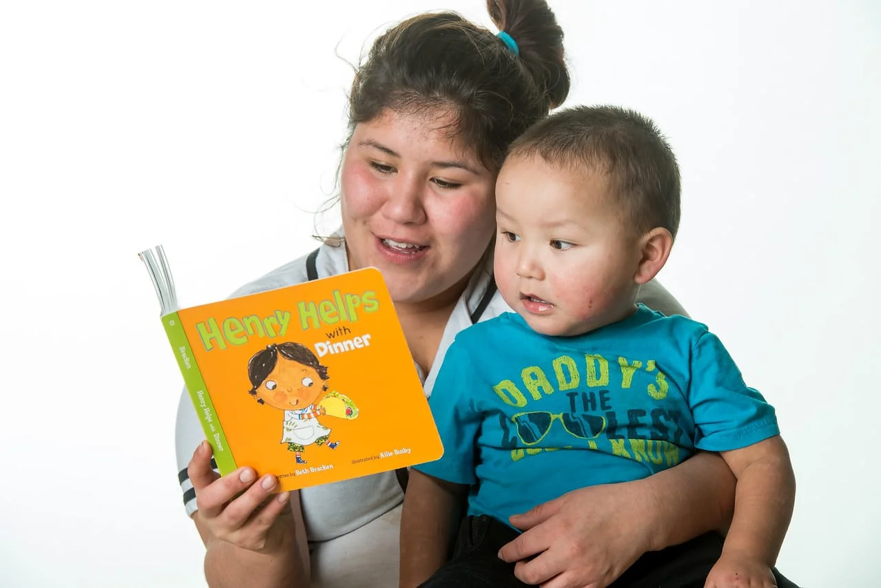 Mother reading to son