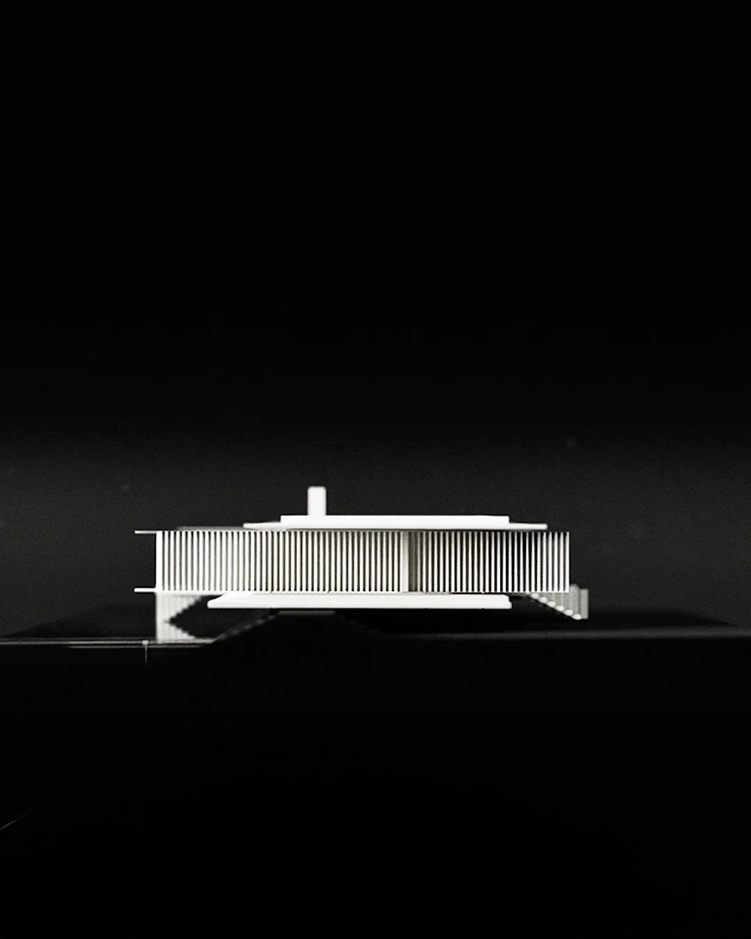 A measured landing
Black Swan House, Scotland 

A home resting on the edge of a reservoir.

Formed through client dialogue, memory, absolute symmetry and proportion. It meets the water with a conscious tension and cantilevered force.

A place in wild