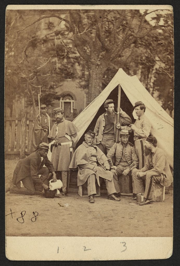Group portrait of soldiers in front of a tent, possibly at Camp Cameron, Washington, D.C. Courtesy of the LOC.