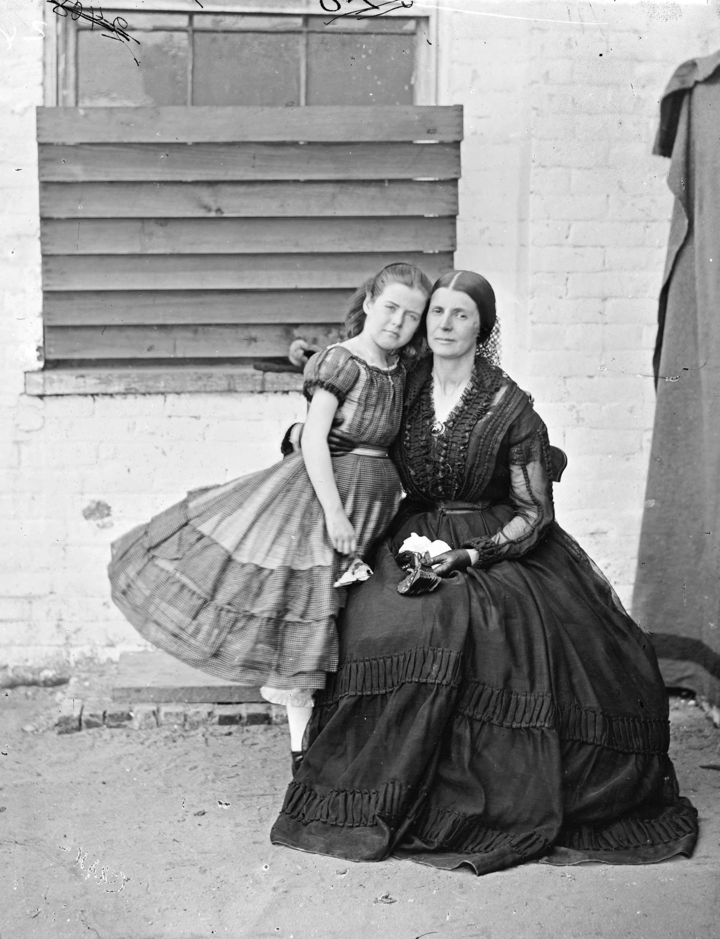 A portrait of Rose and Little Rose, having a little outdoor exercise at Old Capitol Prison. At least they were still able to do their hair?   Wikicommons  