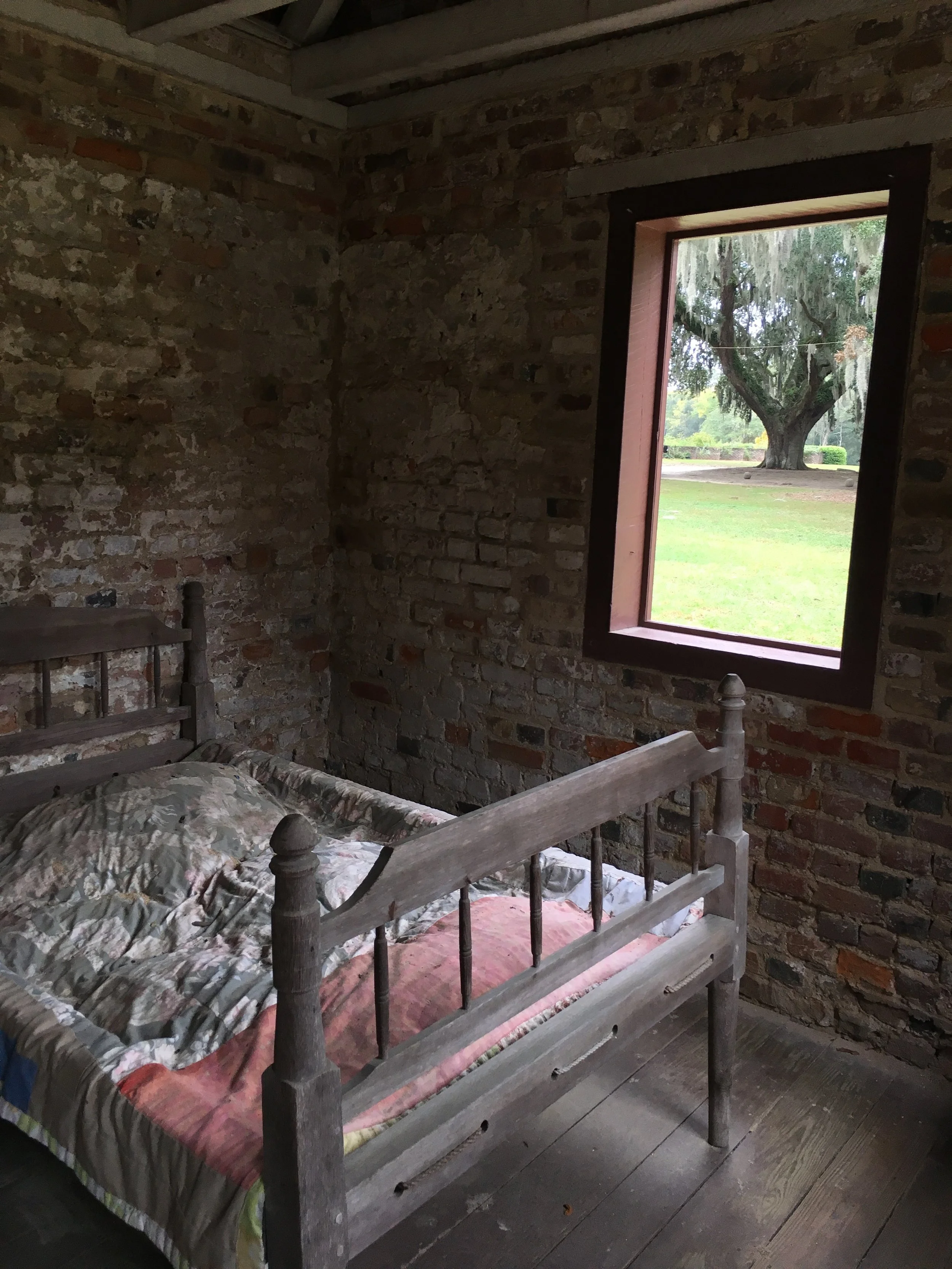  A haunting scene in a slave cabin at Boone Hall Plantation. Many people would have slept on pallets on the floor. 